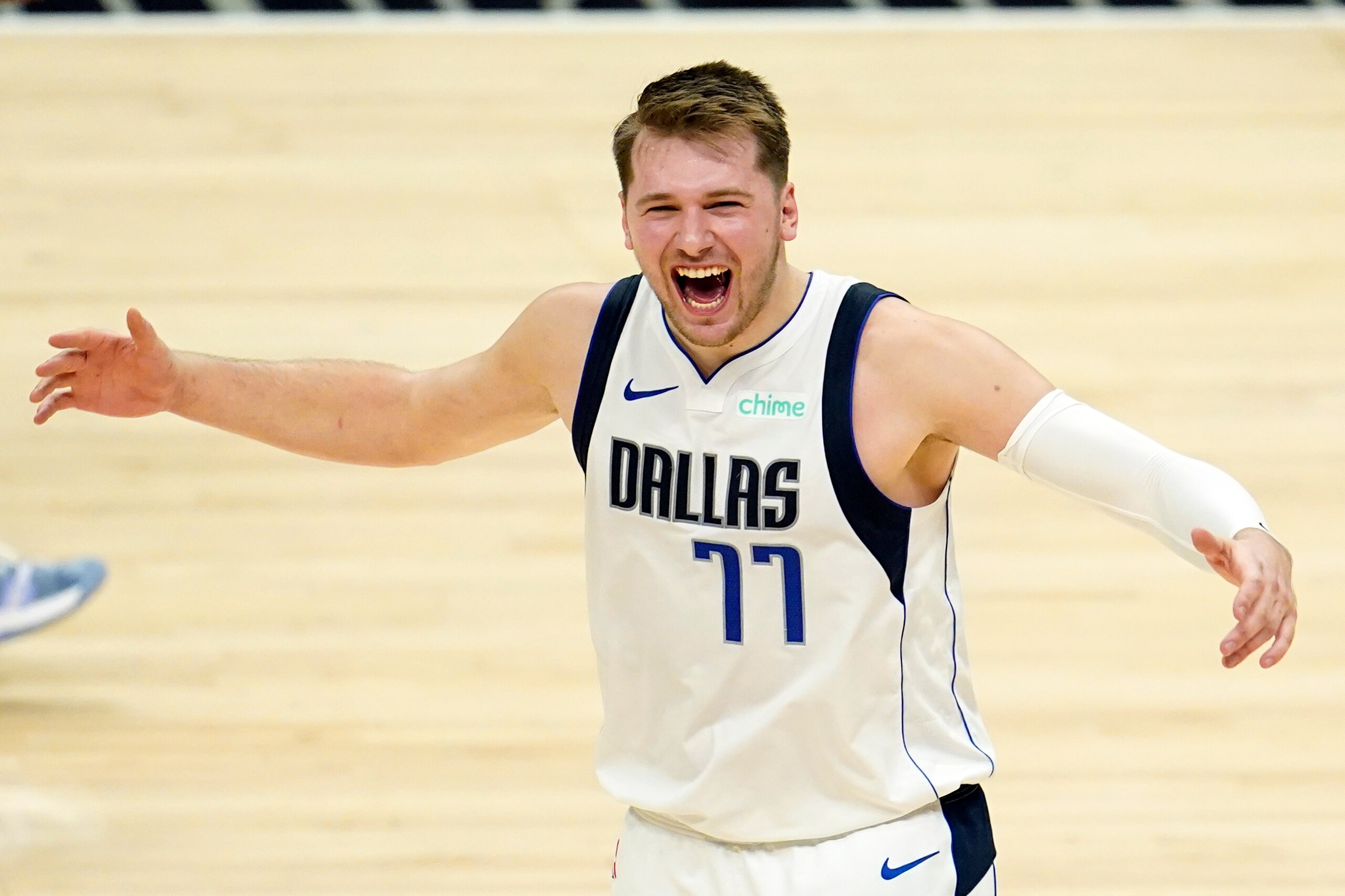Dallas Mavericks guard Luka Doncic (77) celebrates in the closing minutes of a win over the Los Angeles Clippers during Game 2 of an NBA basketball first-round playoff series Tuesday, May 25, 2021, in Los Angeles. (AP Photo/Marcio Jose Sanchez)