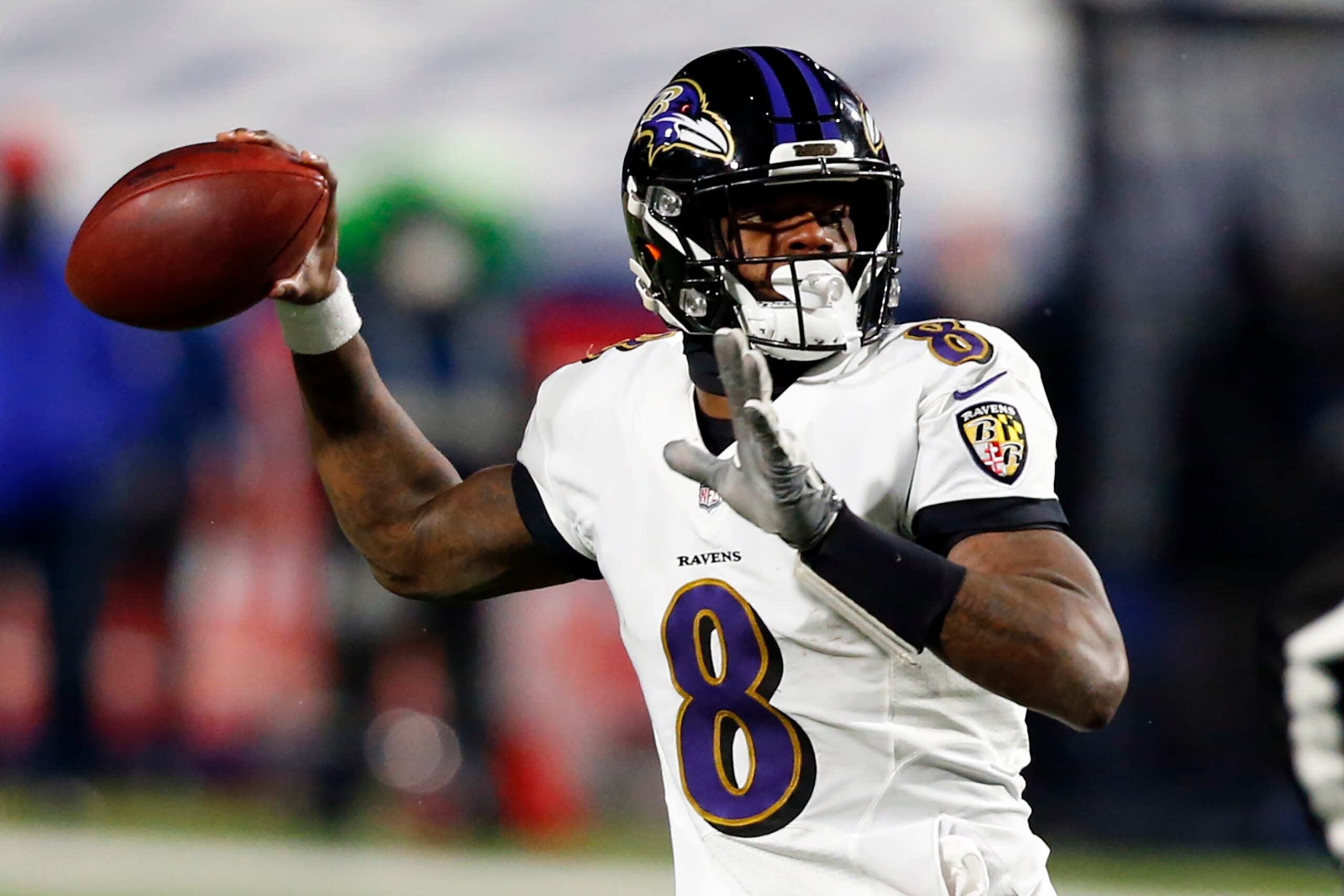 Baltimore Ravens quarterback Lamar Jackson (8) throws a pass for an interception during the second half of an NFL divisional round football game against the Buffalo Bills Saturday, Jan. 16, 2021, in Orchard Park, N.Y. The Bills won 17-3. (AP Photo/Jeffrey T. Barnes)
