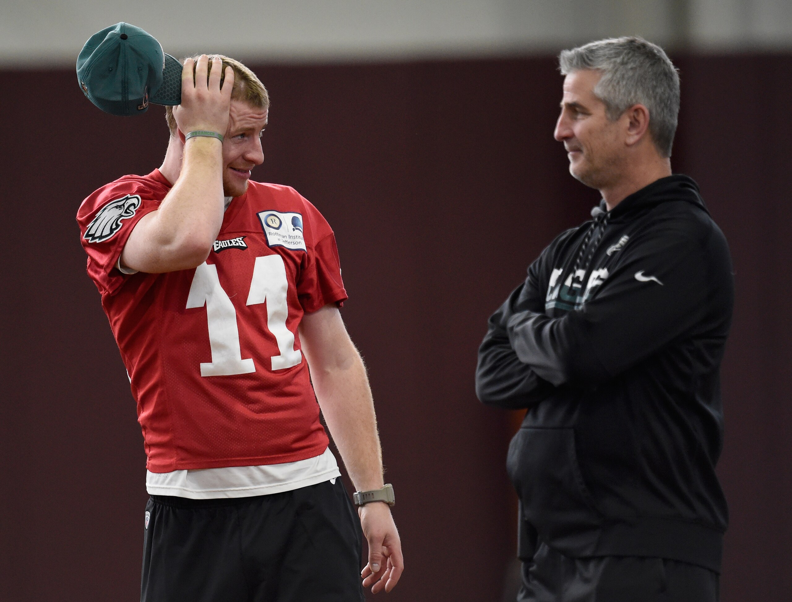 MINNEAPOLIS, MN - FEBRUARY 01: Carson Wentz #11 of the Philadelphia Eagles speaks with offensive coordinator Frank Reich during Super Bowl LII practice on February 1, 2018 at the University of Minnesota in Minneapolis, Minnesota. The Philadelphia Eagles will face the New England Patriots in Super Bowl LII on February 4th. (Photo by Hannah Foslien/Getty Images)