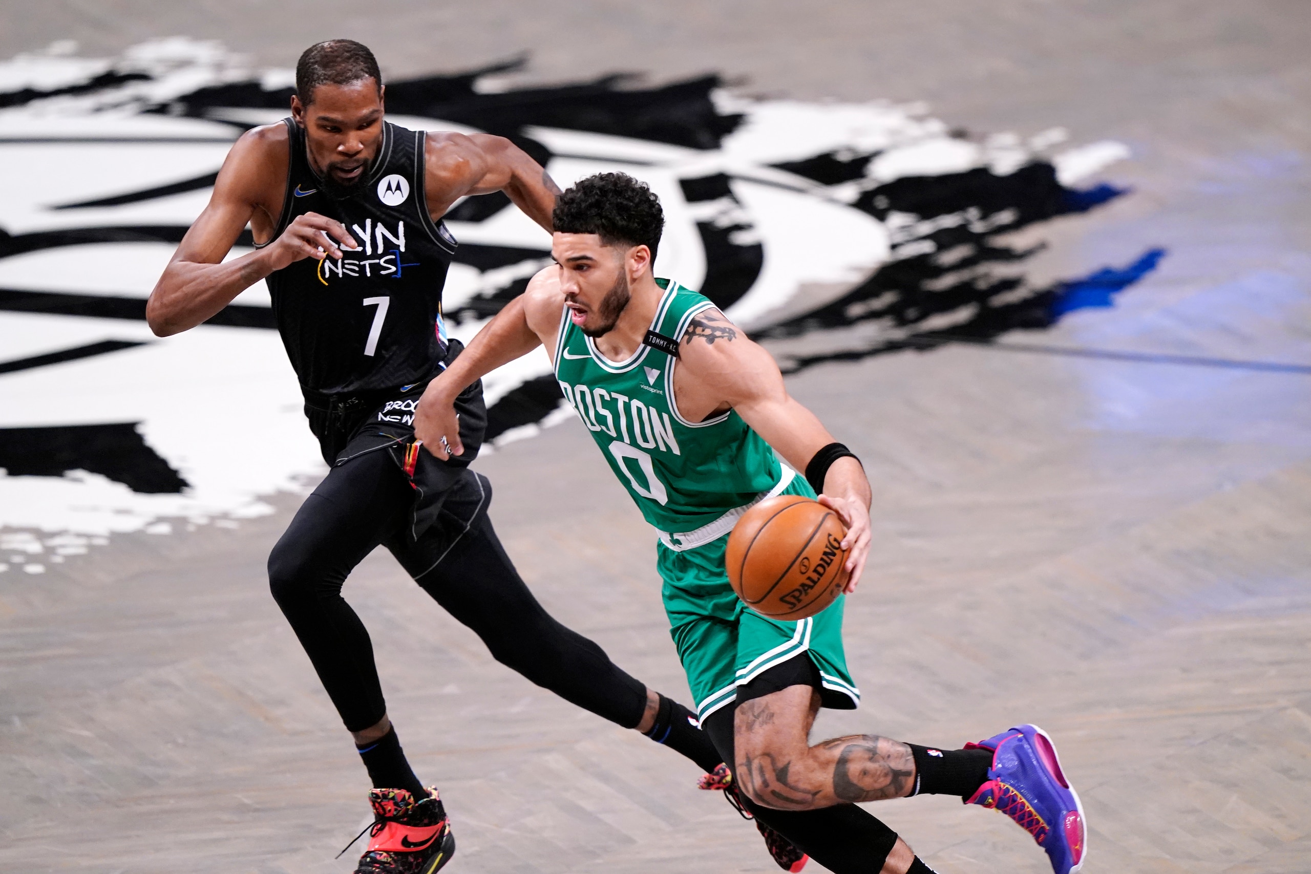 Boston Celtics forward Jayson Tatum (0) drives around Brooklyn Nets forward Kevin Durant (7) during the first quarter of Game 2 of an NBA basketball first-round playoff series Tuesday, May 25, 2021, in New York. (AP Photo/Kathy Willens) Boston Celtics forward Jayson Tatum (0) drives around Brooklyn Nets forward Kevin Durant (7) during the first quarter of Game 2 of an NBA basketball first-round playoff series Tuesday, May 25, 2021, in New York. (AP Photo/Kathy Willens)