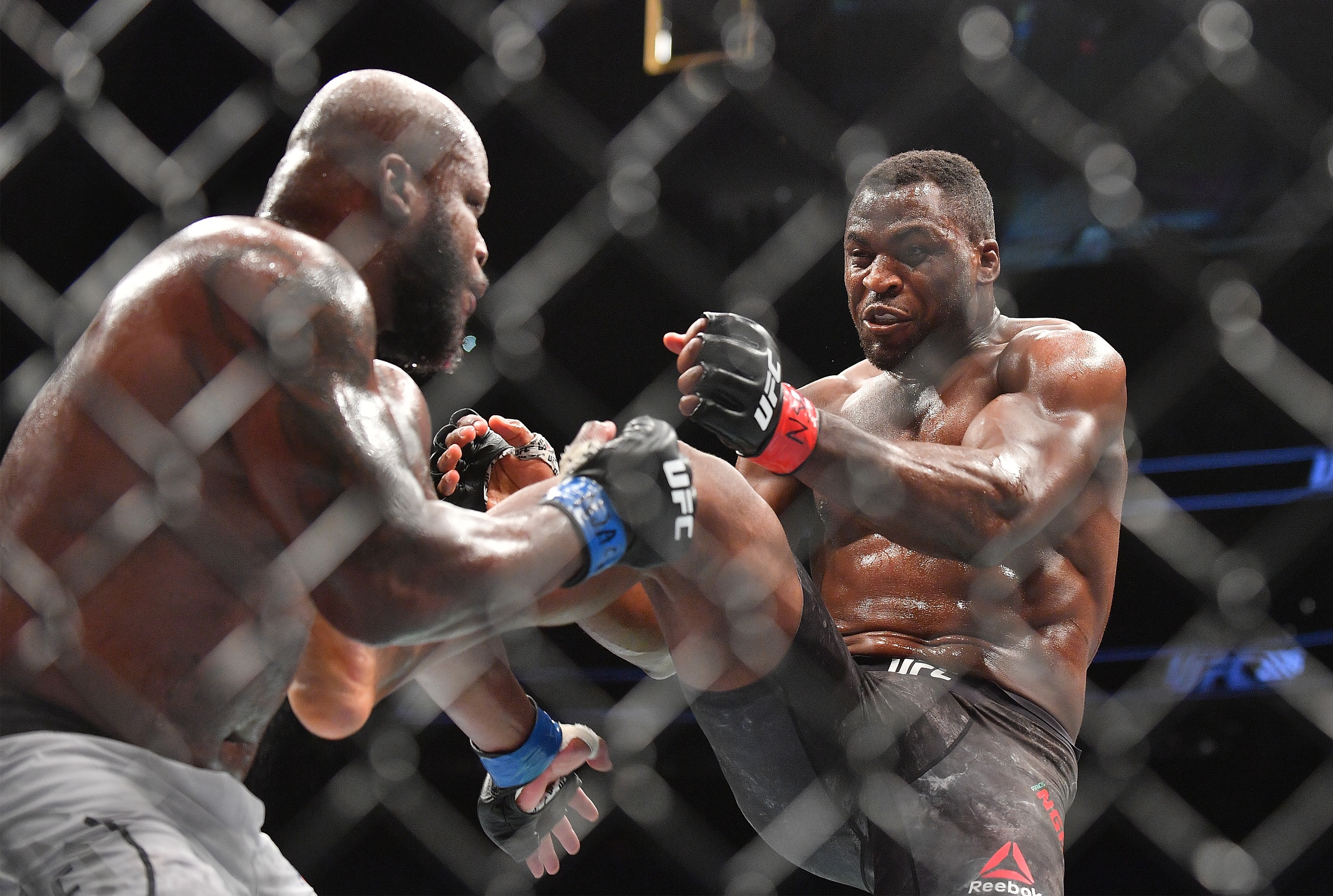 LAS VEGAS, NV - JULY 07:  Francis Ngannou (R) kicks Derrick Lewis during their heavyweight fight at T-Mobile Arena on July 7, 2018 in Las Vegas, Nevada. Lewis won by unanimous decision.  (Photo by Sam Wasson/Getty Images)