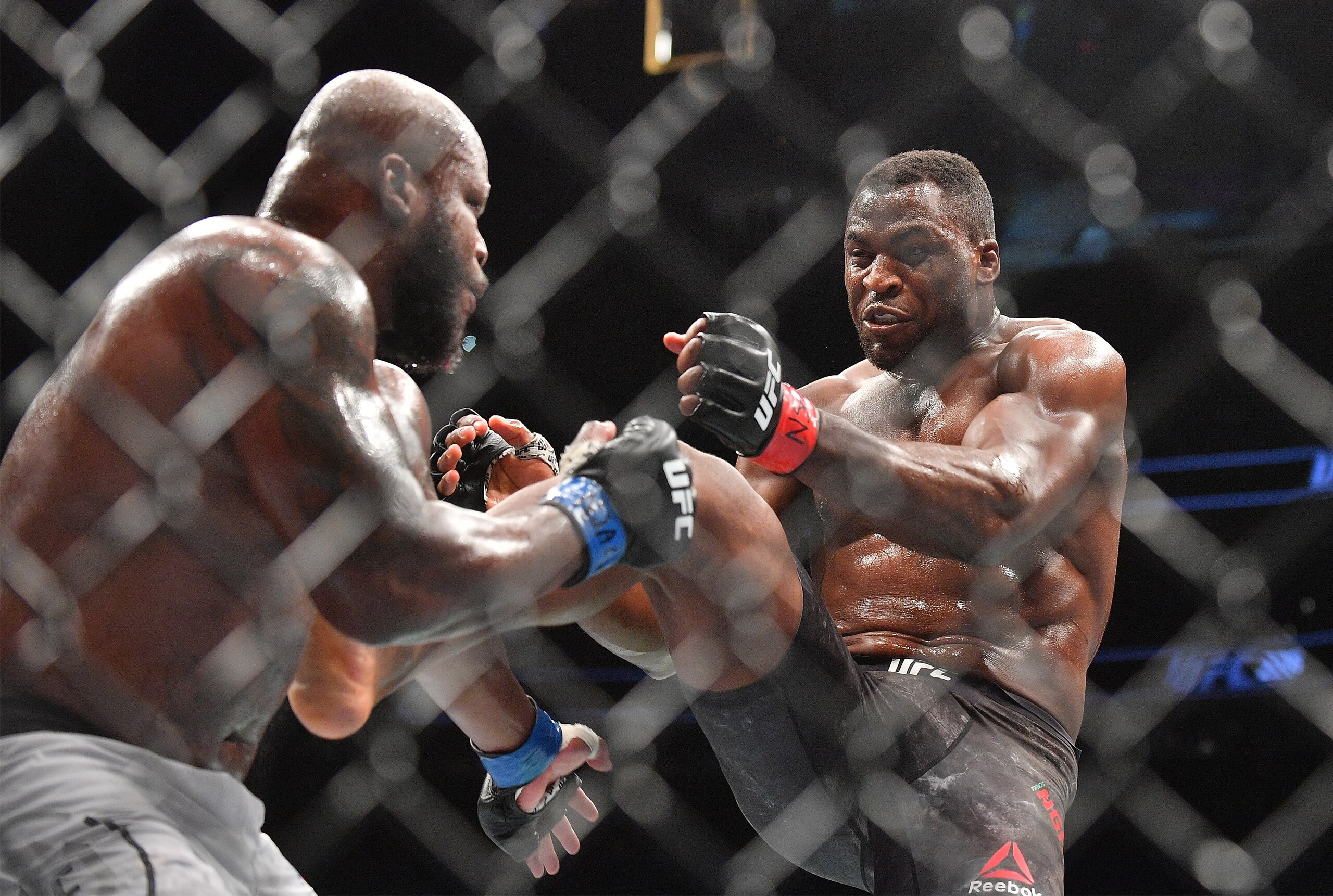 LAS VEGAS, NV - JULY 07:  Francis Ngannou (R) kicks Derrick Lewis during their heavyweight fight at T-Mobile Arena on July 7, 2018 in Las Vegas, Nevada. Lewis won by unanimous decision.  (Photo by Sam Wasson/Getty Images)
