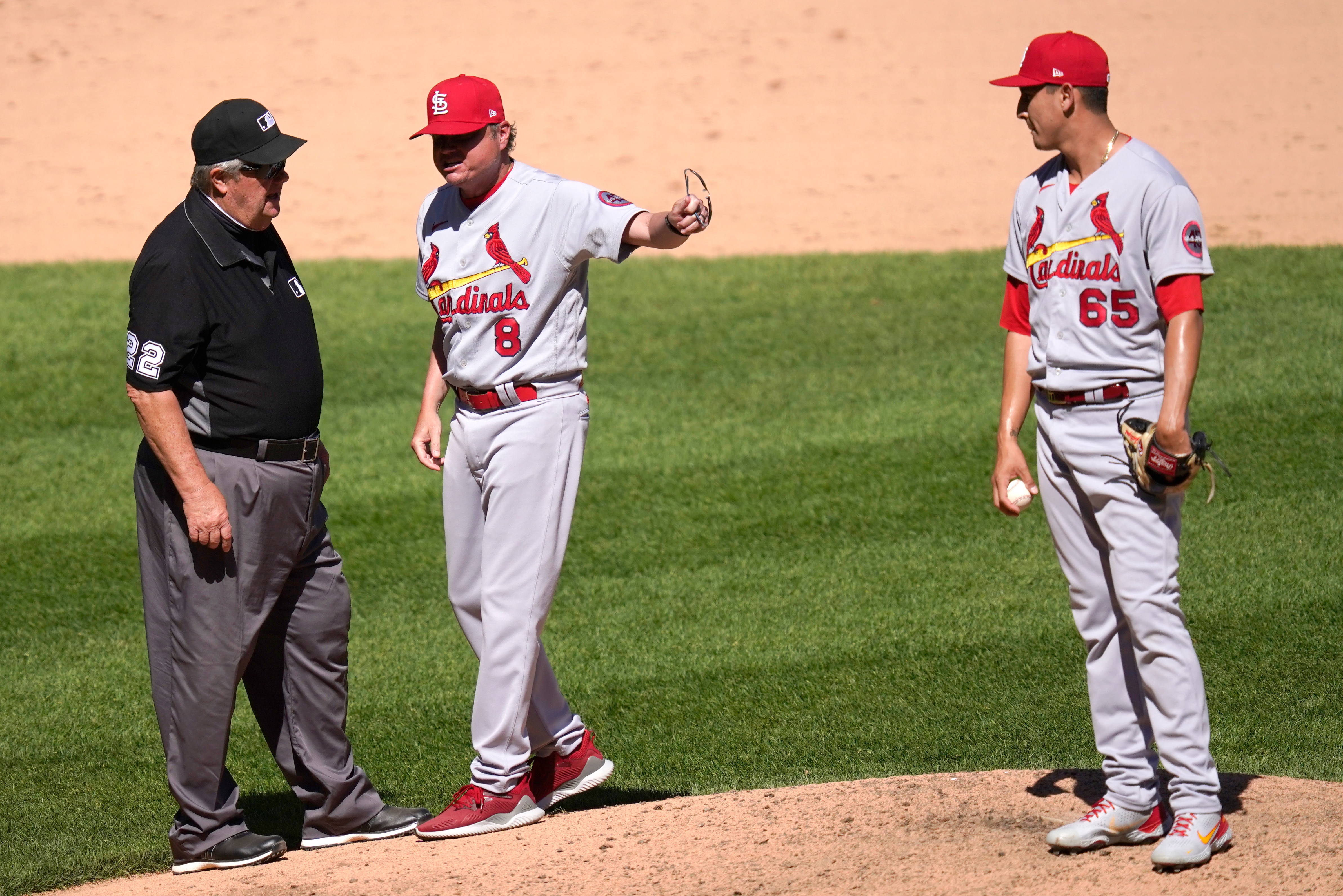 St. Louis Cardinals manager Mike Shildt, center, continues to speak his mind as he points to relief pitcher Giovanny Gallegos after third base umpire Joe West, left, ejected Shildt during the seventh inning of an interleague baseball game against the Chicago White Sox Wednesday, May 26, 2021, in Chicago. (AP Photo/Charles Rex Arbogast)