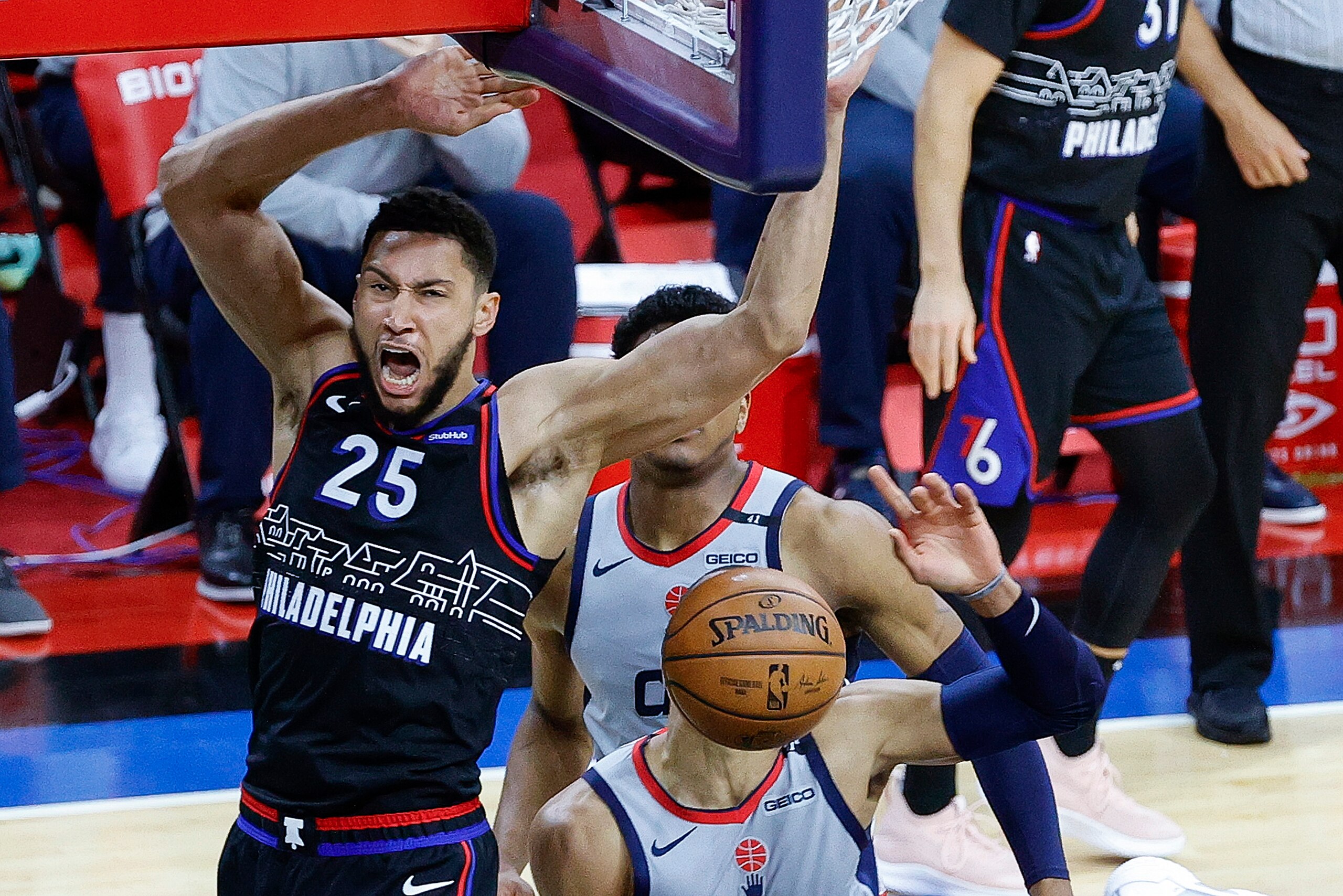 PHILADELPHIA, PENNSYLVANIA - MAY 26: Ben Simmons #25 of the Philadelphia 76ers dunks over Russell Westbrook #4 of the Washington Wizards during Game Two of the Eastern Conference first round series at Wells Fargo Center on May 26, 2021 in Philadelphia, Pennsylvania. NOTE TO USER: User expressly acknowledges and agrees that, by downloading and or using this photograph, User is consenting to the terms and conditions of the Getty Images License Agreement.  (Photo by Tim Nwachukwu/Getty Images)