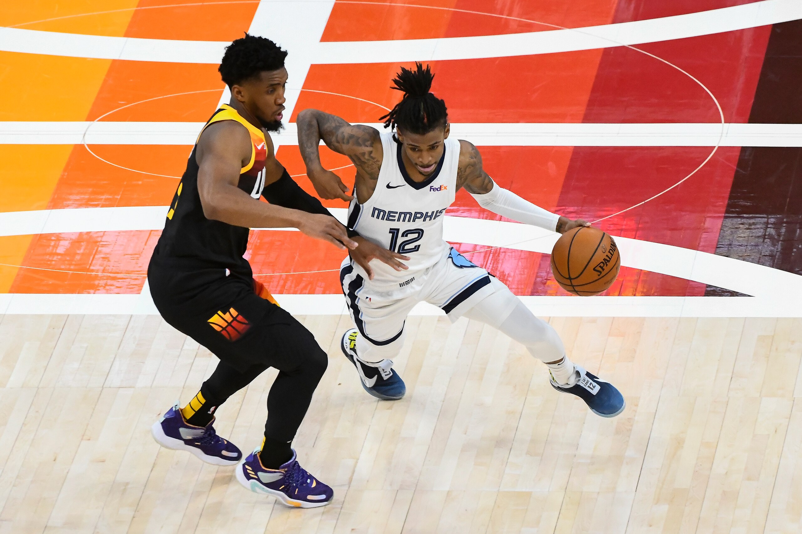SALT LAKE CITY, UTAH - MAY 26: Ja Morant #12 of the Memphis Grizzlies drives around Donovan Mitchell #45 of the Utah Jazz in Game Two of the Western Conference first-round playoff series at Vivint Smart Home Arena on May 26, 2021 in Salt Lake City, Utah. NOTE TO USER: User expressly acknowledges and agrees that, by downloading and/or using this photograph, user is consenting to the terms and conditions of the Getty Images License Agreement. (Photo by Alex Goodlett/Getty Images) SALT LAKE CITY, UTAH - MAY 26: Ja Morant #12 of the Memphis Grizzlies drives around Donovan Mitchell #45 of the Utah Jazz in Game Two of the Western Conference first-round playoff series at Vivint Smart Home Arena on May 26, 2021 in Salt Lake City, Utah. NOTE TO USER: User expressly acknowledges and agrees that, by downloading and/or using this photograph, user is consenting to the terms and conditions of the Getty Images License Agreement. (Photo by Alex Goodlett/Getty Images)