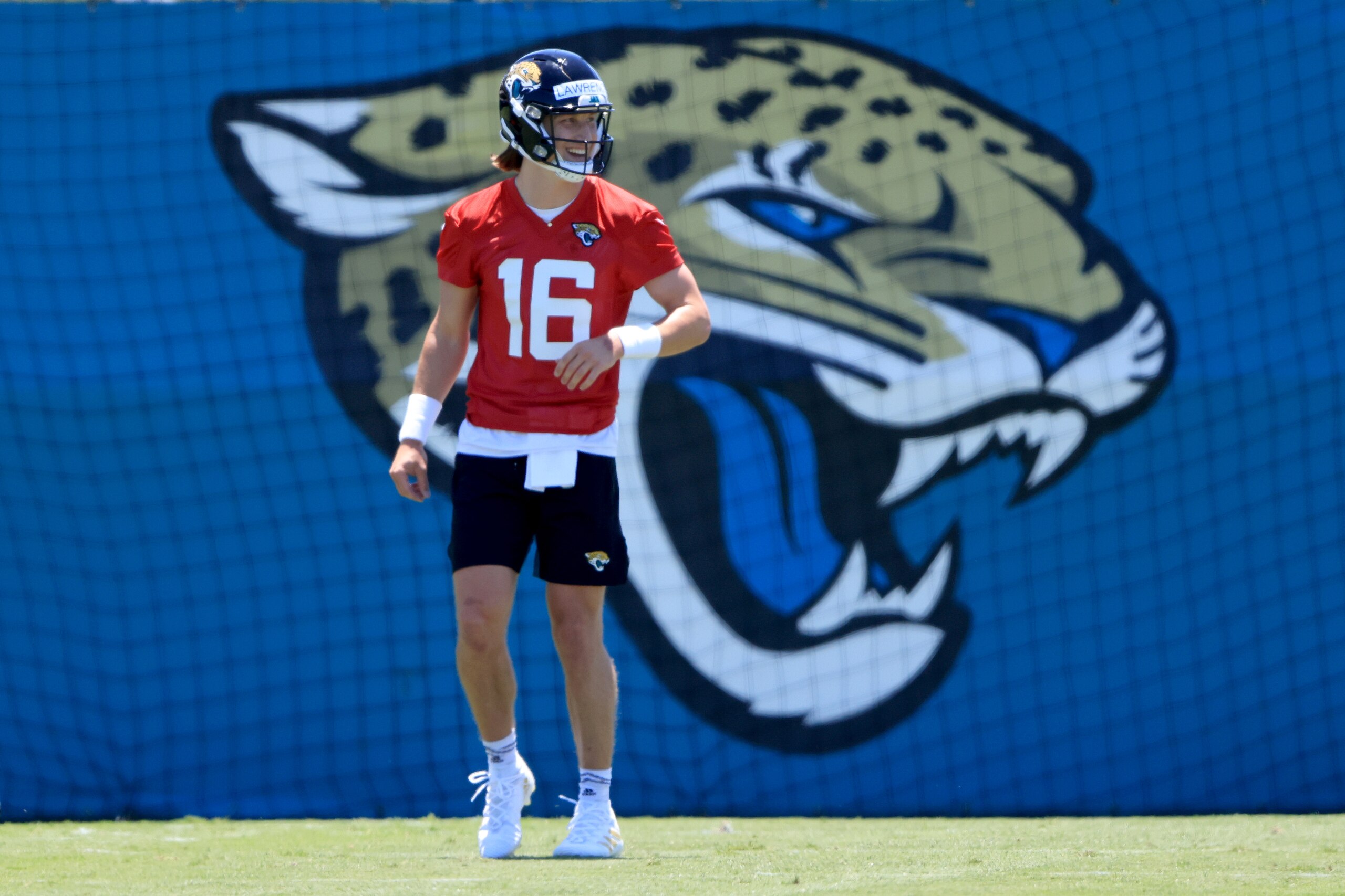 JACKSONVILLE, FLORIDA - MAY 15: Trevor Lawrence #16 of the Jacksonville Jaguars runs drills during Jacksonville Jaguars Training Camp at TIAA Bank Field on May 15, 2021 in Jacksonville, Florida. (Photo by Sam Greenwood/Getty Images)