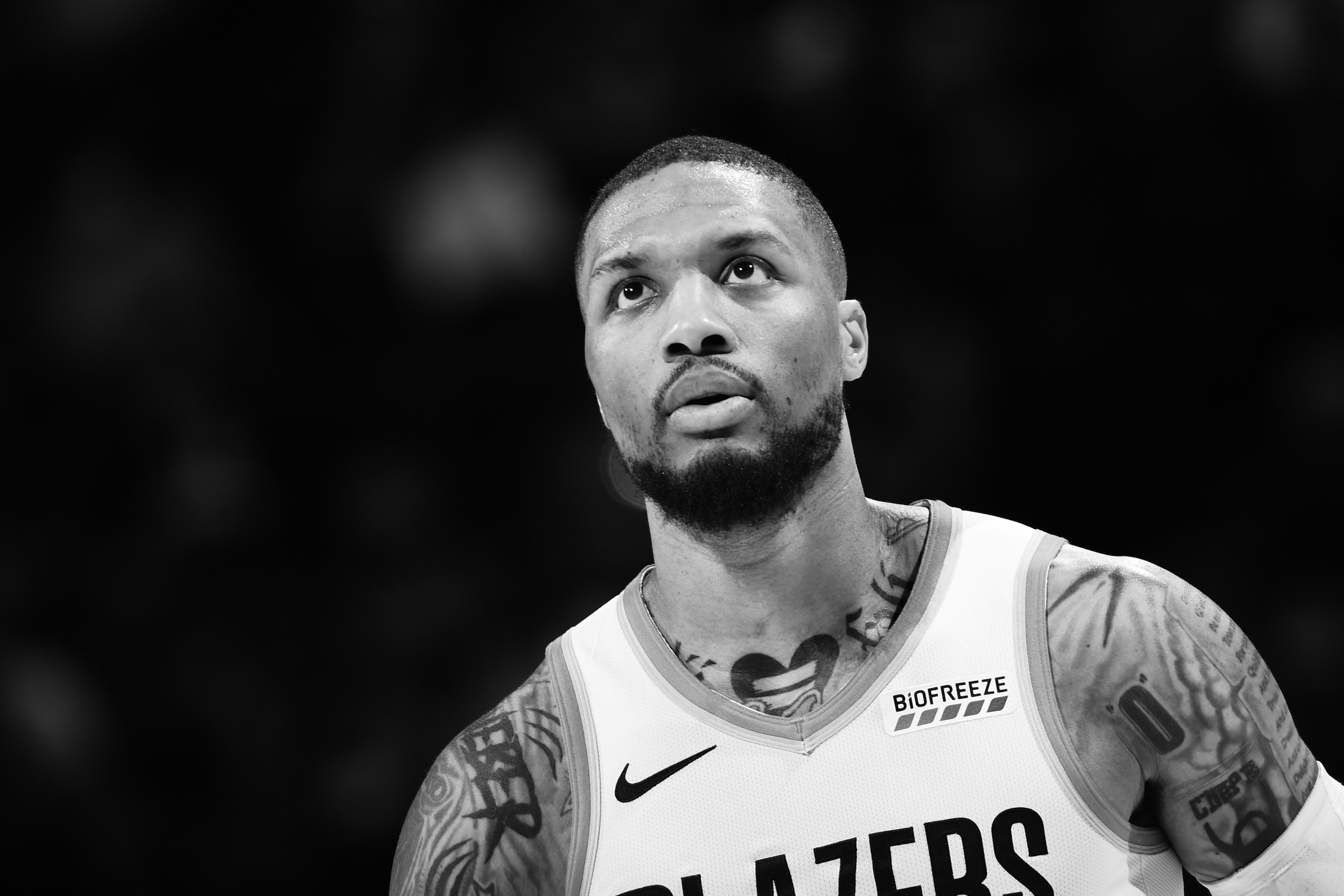 DENVER, CO - MAY 24: (EDITOR NOTE: This image has been converted to black and white) Damian Lillard #0 of the Portland Trail Blazers looks on during Round 1, Game 2 of the NBA 2021 Playoffs on May 24, 2021 at the Ball Arena in Denver, Colorado. NOTE TO USER: User expressly acknowledges and agrees that, by downloading and/or using this Photograph, user is consenting to the terms and conditions of the Getty Images License Agreement. Mandatory Copyright Notice: Copyright 2021 NBAE (Photo by Garrett Ellwood/NBAE via Getty Images)
