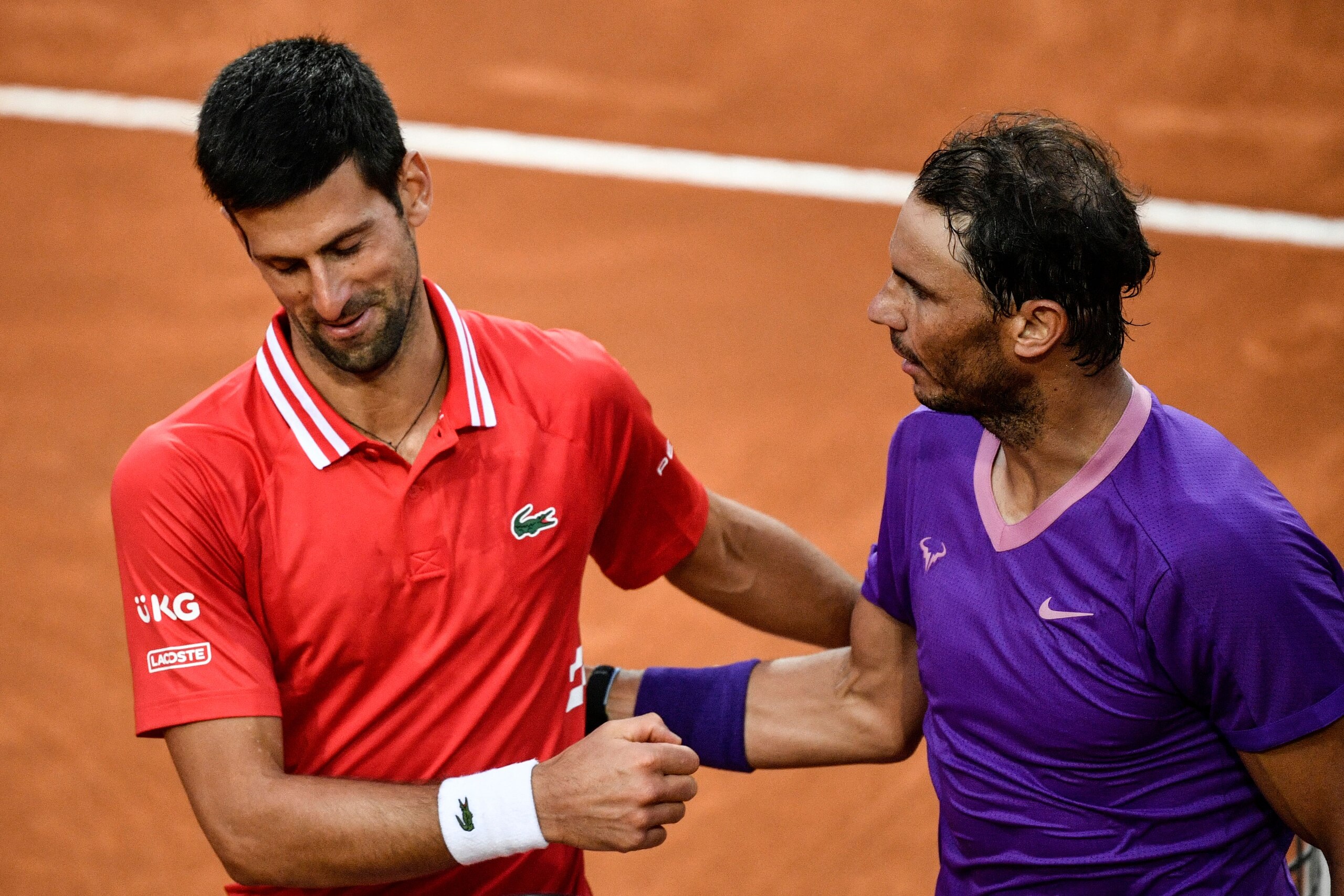 Spain's Rafael Nadal (R) greets Serbia's Novak Djokovic after defeating him in the final of the Men's Italian Tennis Open at Foro Italico on May 16, 2021 in Rome, Italy. (Photo by Filippo MONTEFORTE / AFP) (Photo by FILIPPO MONTEFORTE/AFP via Getty Images)
