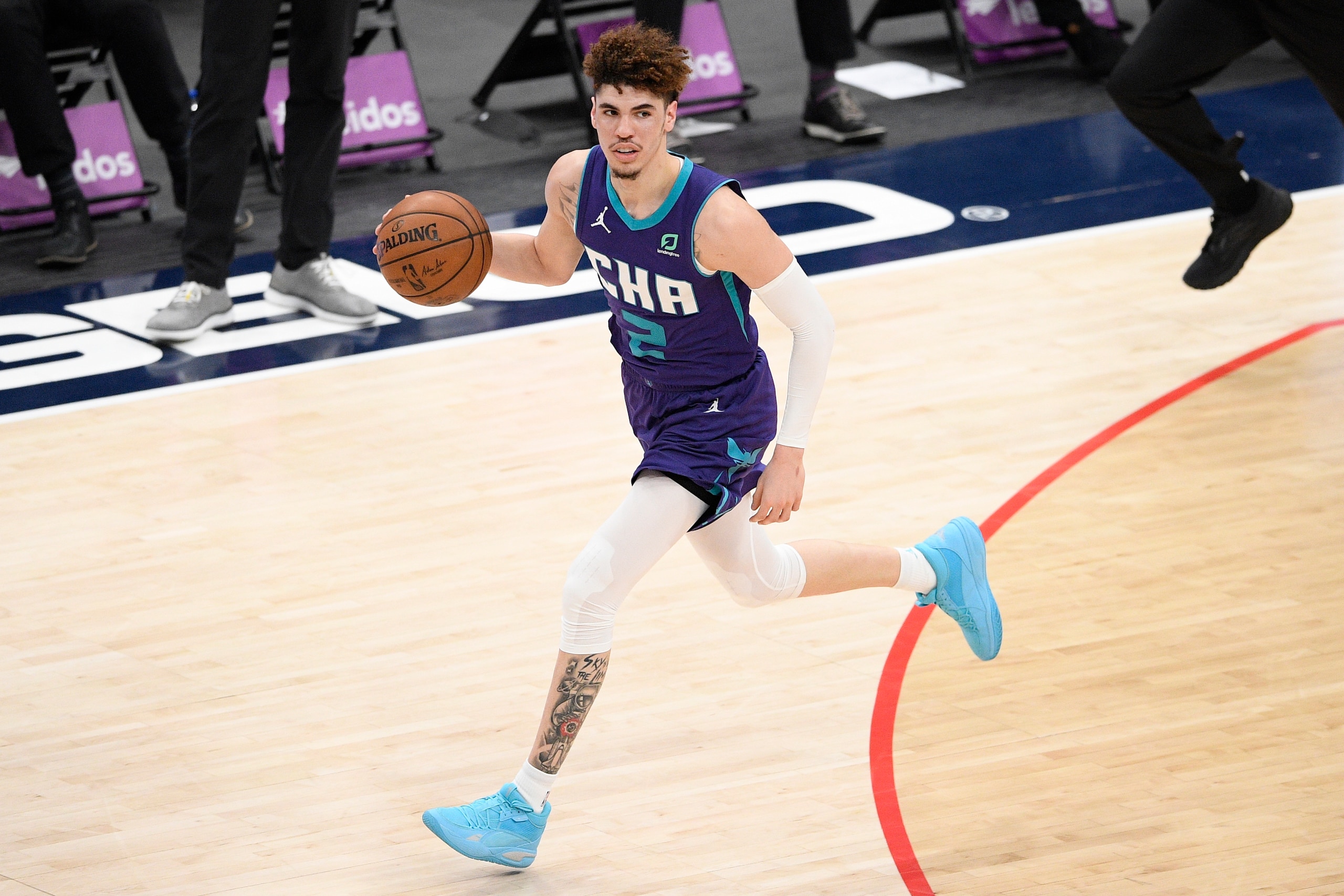 Charlotte Hornets guard LaMelo Ball (2) dribbles the ball during the second half of an NBA basketball game against the Washington Wizards, Sunday, May 16, 2021, in Washington. (AP Photo/Nick Wass)