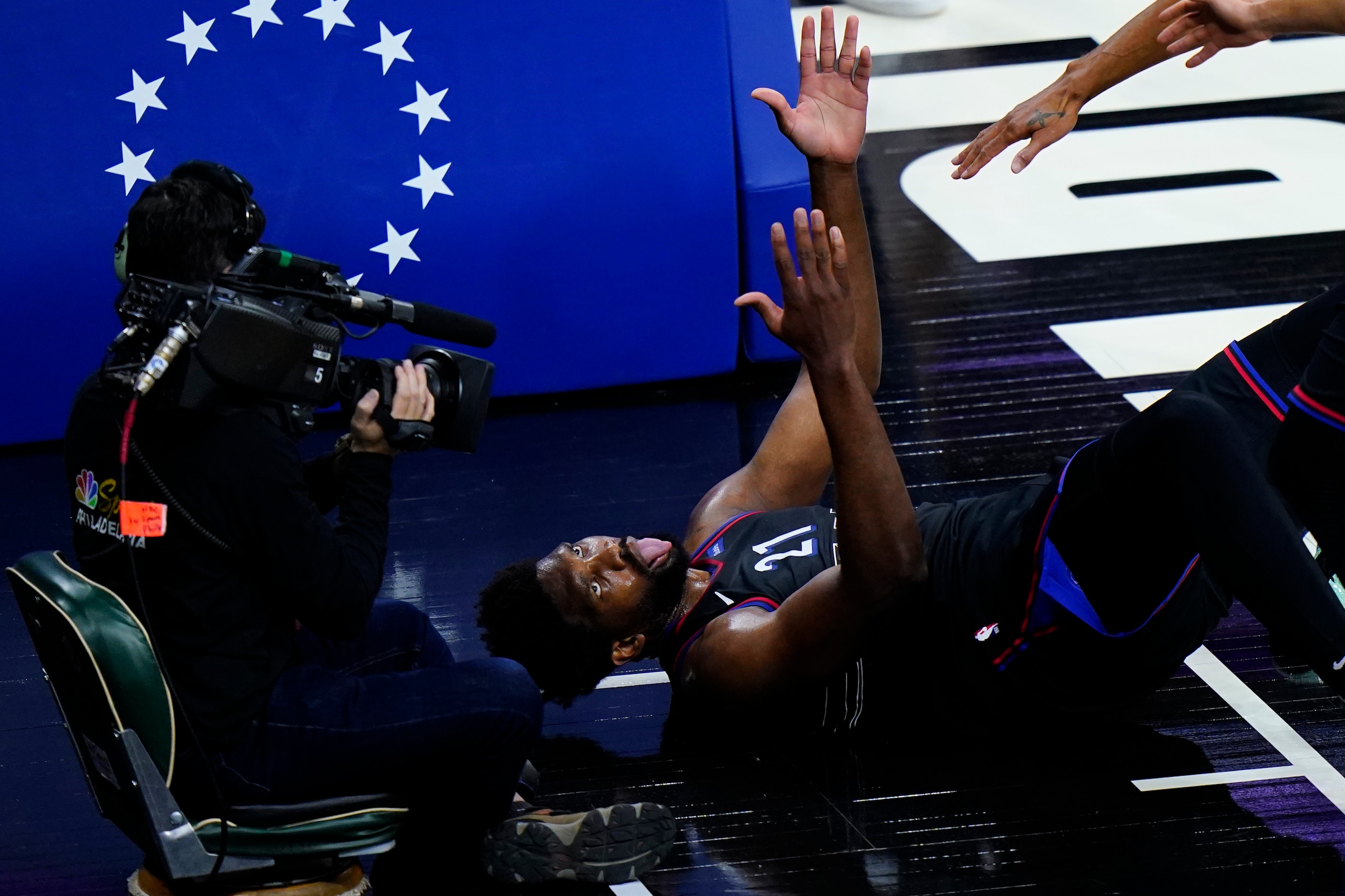 Philadelphia 76ers' Joel Embiid reacts after being fouled during the first half of Game 2 in a first-round NBA basketball playoff series against the Washington Wizards, Wednesday, May 26, 2021, in Philadelphia. (AP Photo/Matt Slocum)