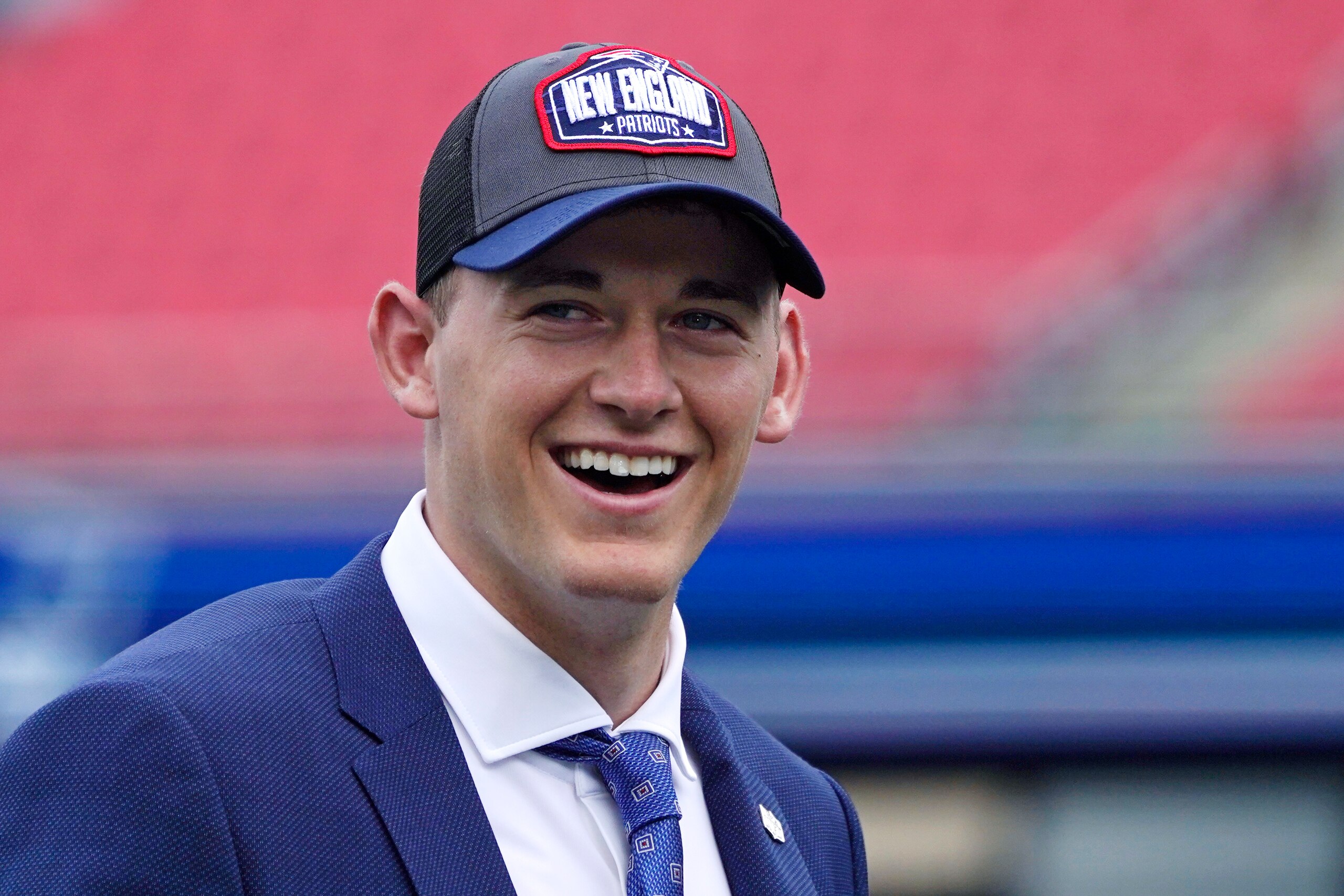 New England Patriots 2021 first-round draft pick, former Alabama quarterback Mac Jones smiles while addressing the media, Friday, April 30, 2021, in Foxborough, Mass. The Patriots selected Jones with the 15th pick in Thursday's NFL Draft. (AP Photo/Charles Krupa)