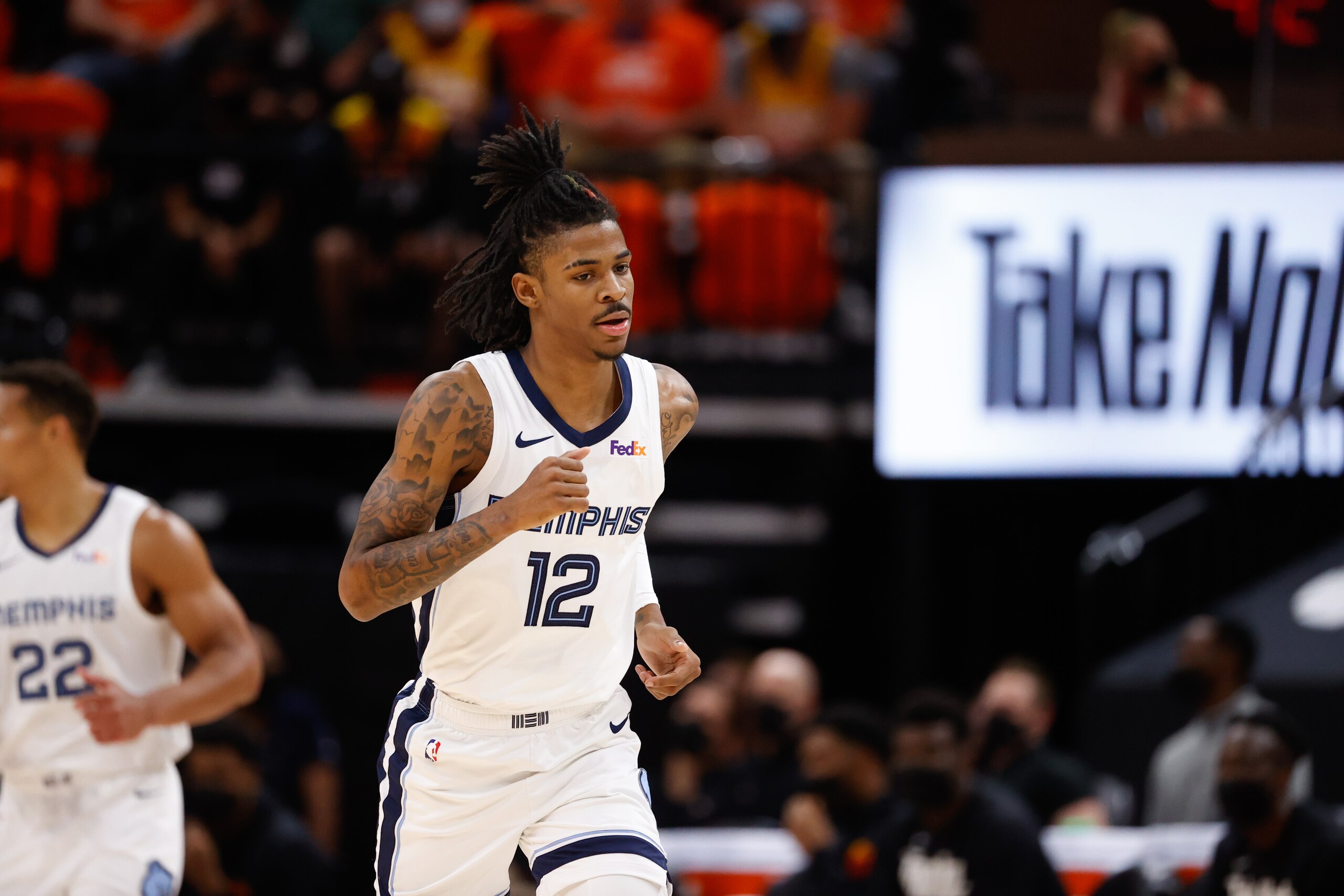SALT LAKE CITY, UT - MAY 26: Ja Morant #12 of the Memphis Grizzlies runs down the court during the game against the Utah Jazz during Round 1, Game 2 of the 2021 NBA Playoffs on May 26, 2021 at vivint.SmartHome Arena in Salt Lake City, Utah. NOTE TO USER: User expressly acknowledges and agrees that, by downloading and or using this Photograph, User is consenting to the terms and conditions of the Getty Images License Agreement. Mandatory Copyright Notice: Copyright 2021 NBAE (Photo by Jeff Swinger/NBAE via Getty Images)