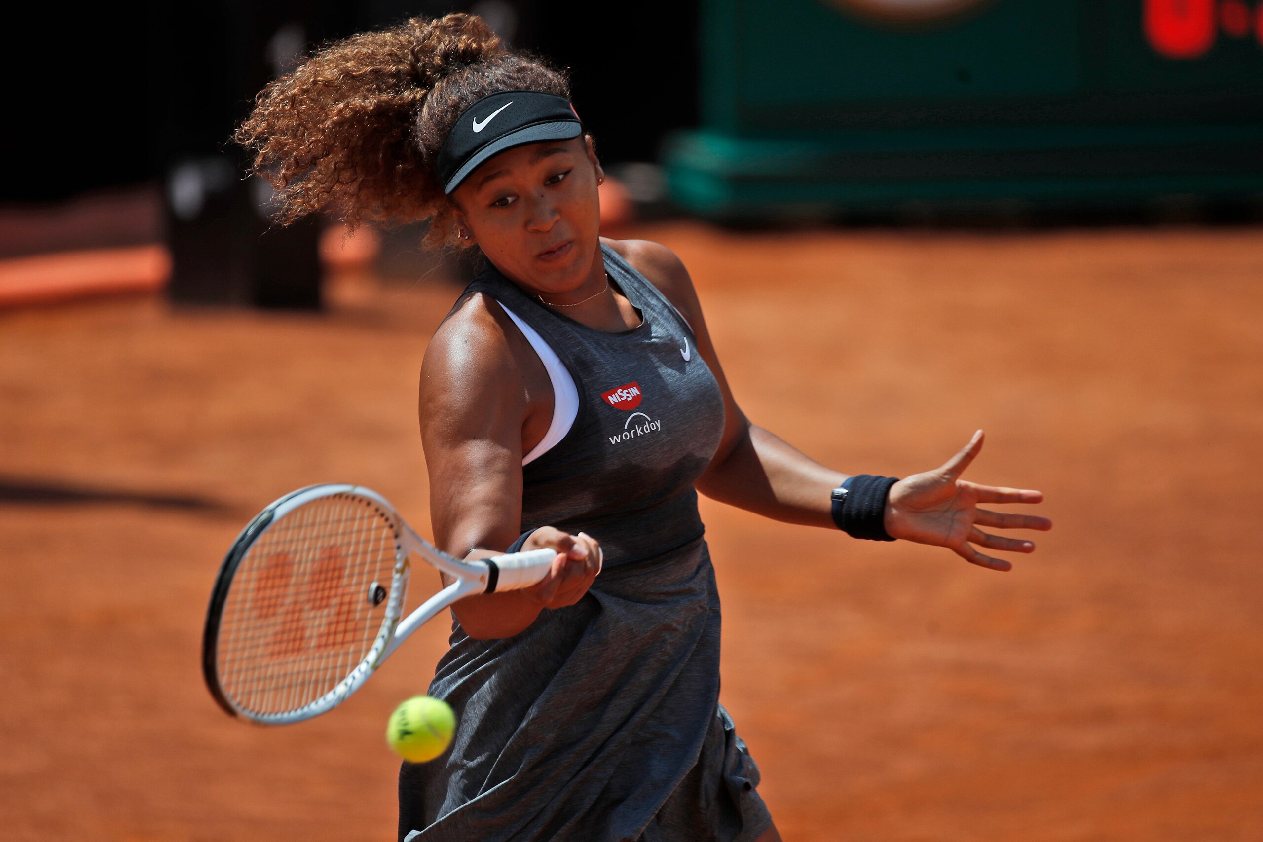 Naomi Osaka of Japan returns the ball to Jessica Pegula of the United States during their match at the Italian Open tennis tournament, in Rome, Wednesday, May 12, 2021. Osaka lost against Pegula 7-6, 6-2. (AP Photo/Alessandra Tarantino) Naomi Osaka of Japan returns the ball to Jessica Pegula of the United States during their match at the Italian Open tennis tournament, in Rome, Wednesday, May 12, 2021. Osaka lost against Pegula 7-6, 6-2. (AP Photo/Alessandra Tarantino)