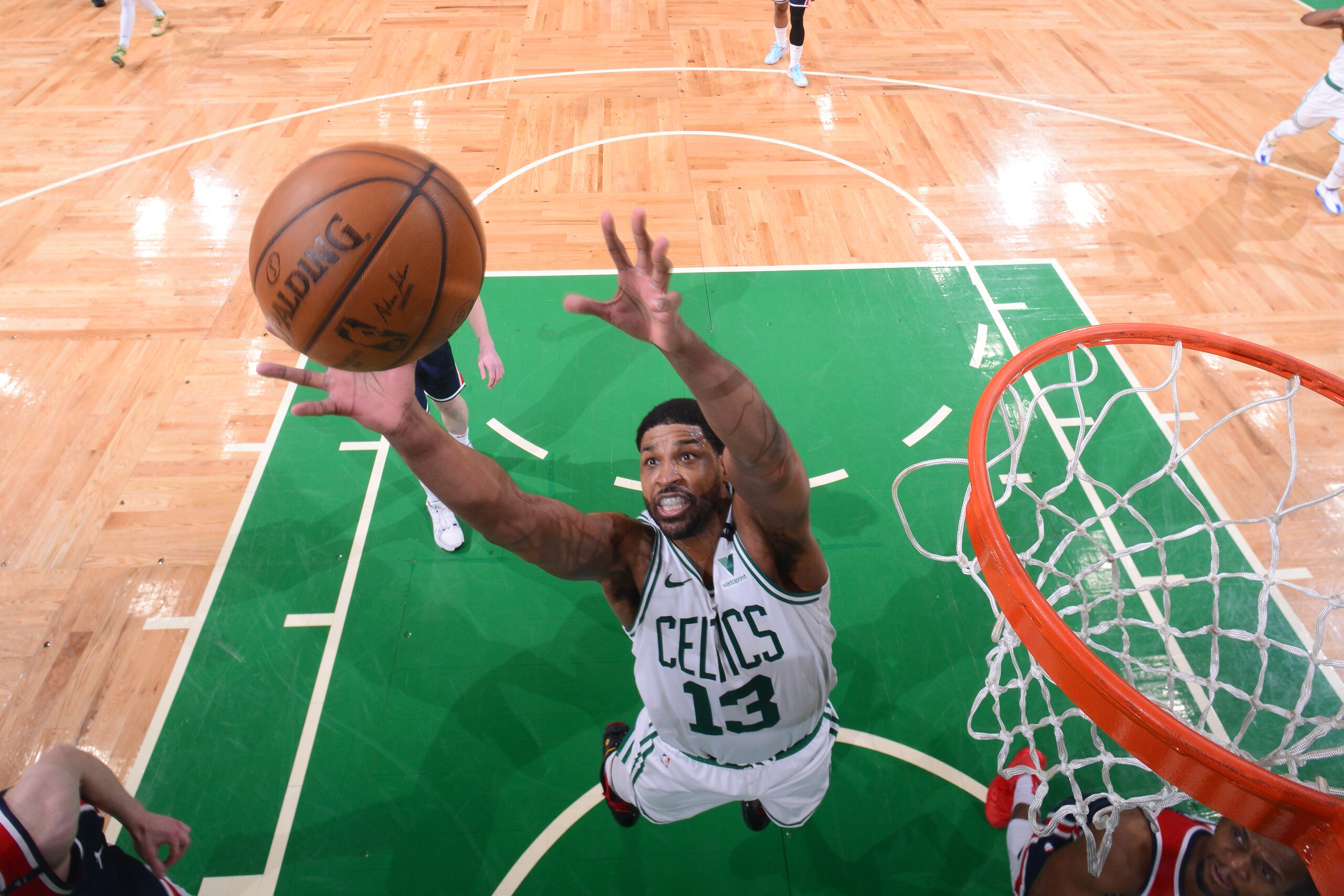 BOSTON, MA - MAY 18: Tristan Thompson #13 of the Boston Celtics reaches for a rebound during the game against the Washington Wizards during the 2021 NBA Play-In Tournament on May 18, 2021 at the TD Garden in Boston, Massachusetts.  NOTE TO USER: User expressly acknowledges and agrees that, by downloading and or using this photograph, User is consenting to the terms and conditions of the Getty Images License Agreement. Mandatory Copyright Notice: Copyright 2021 NBAE  (Photo by Brian Babineau/NBAE via Getty Images)