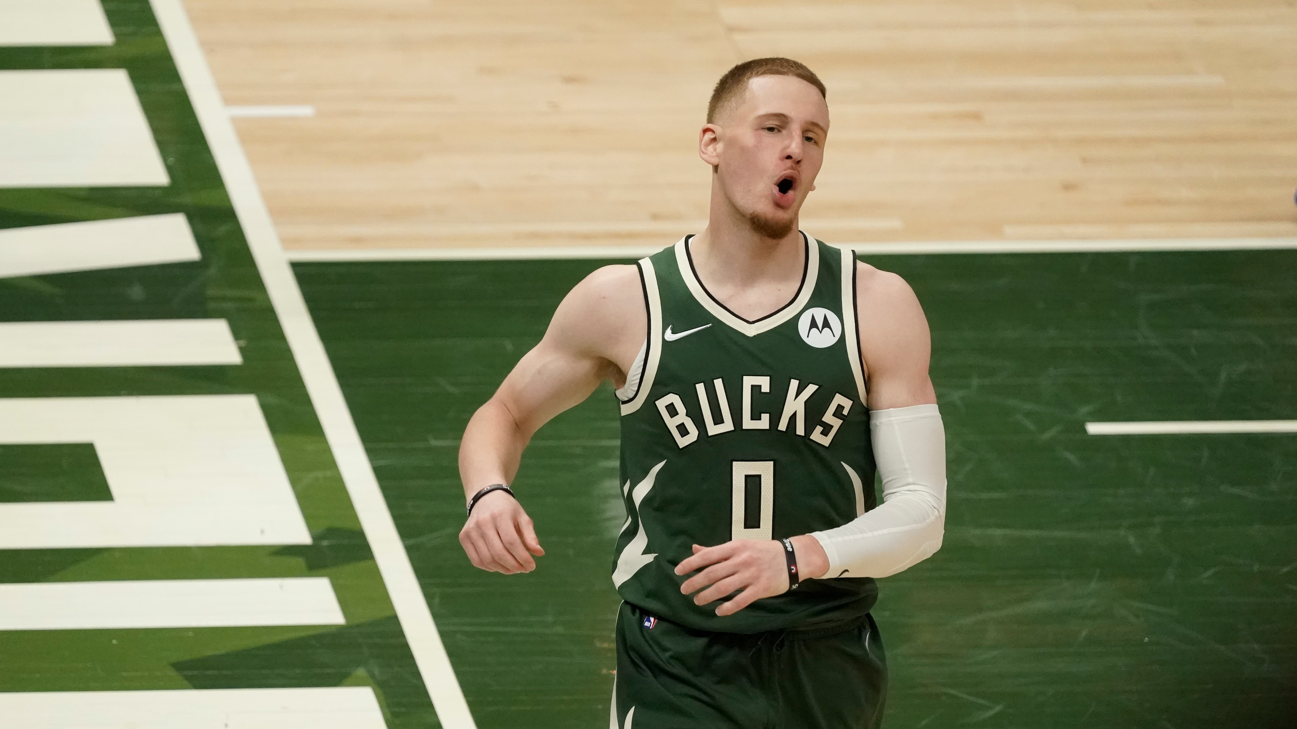 Milwaukee Bucks' Donte DiVincenzo runs during the second half of Game 1 of their NBA basketball first-round playoff series against the Miami Heat Saturday, May 22, 2021, in Milwaukee. (AP Photo/Morry Gash)