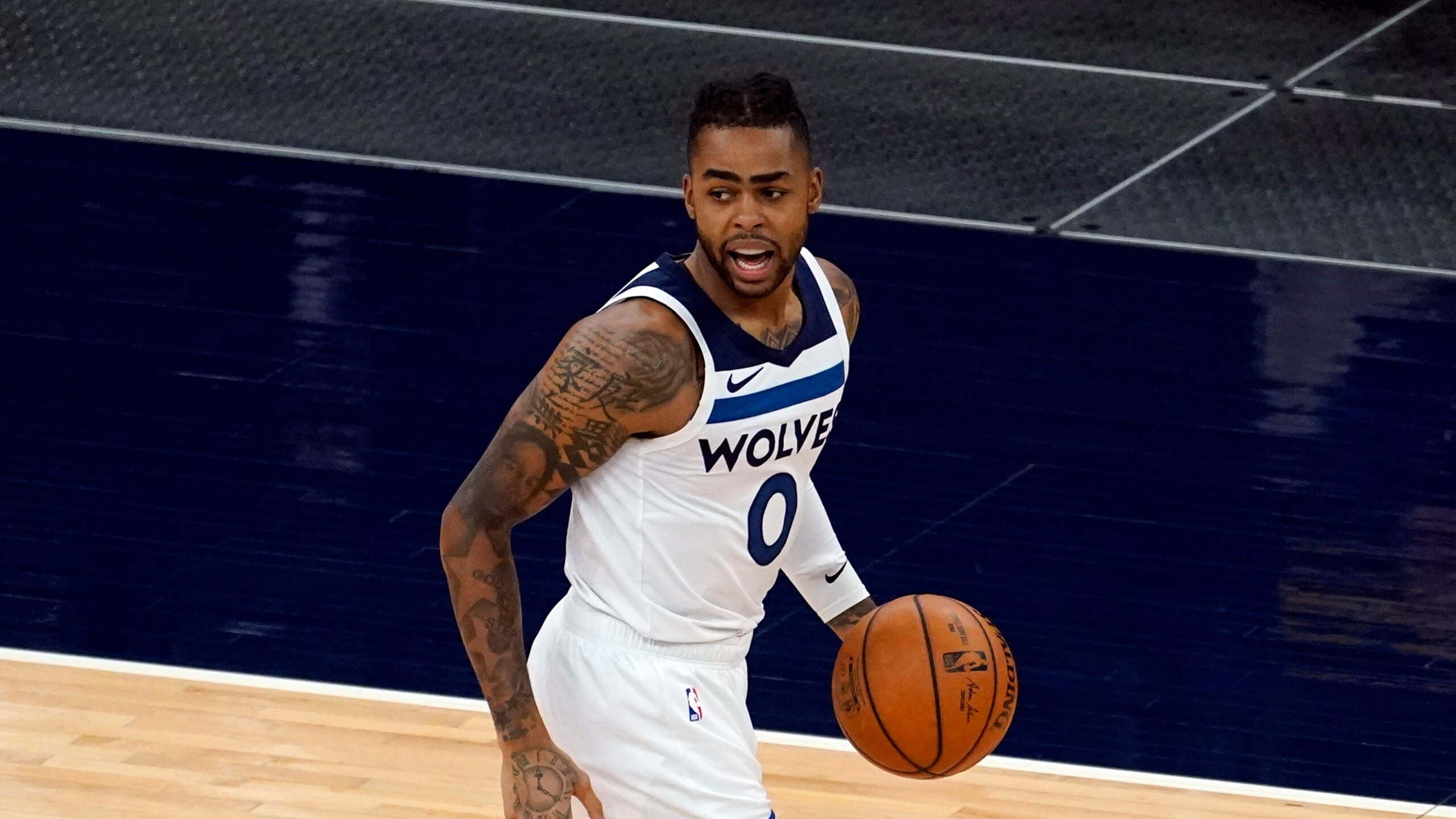 Minnesota Timberwolves' D'Angelo Russell (0) plays in an NBA basketball game against the Milwaukee Bucks, Wednesday, April 14, 2021, in Minneapolis. (AP Photo/Jim Mone)