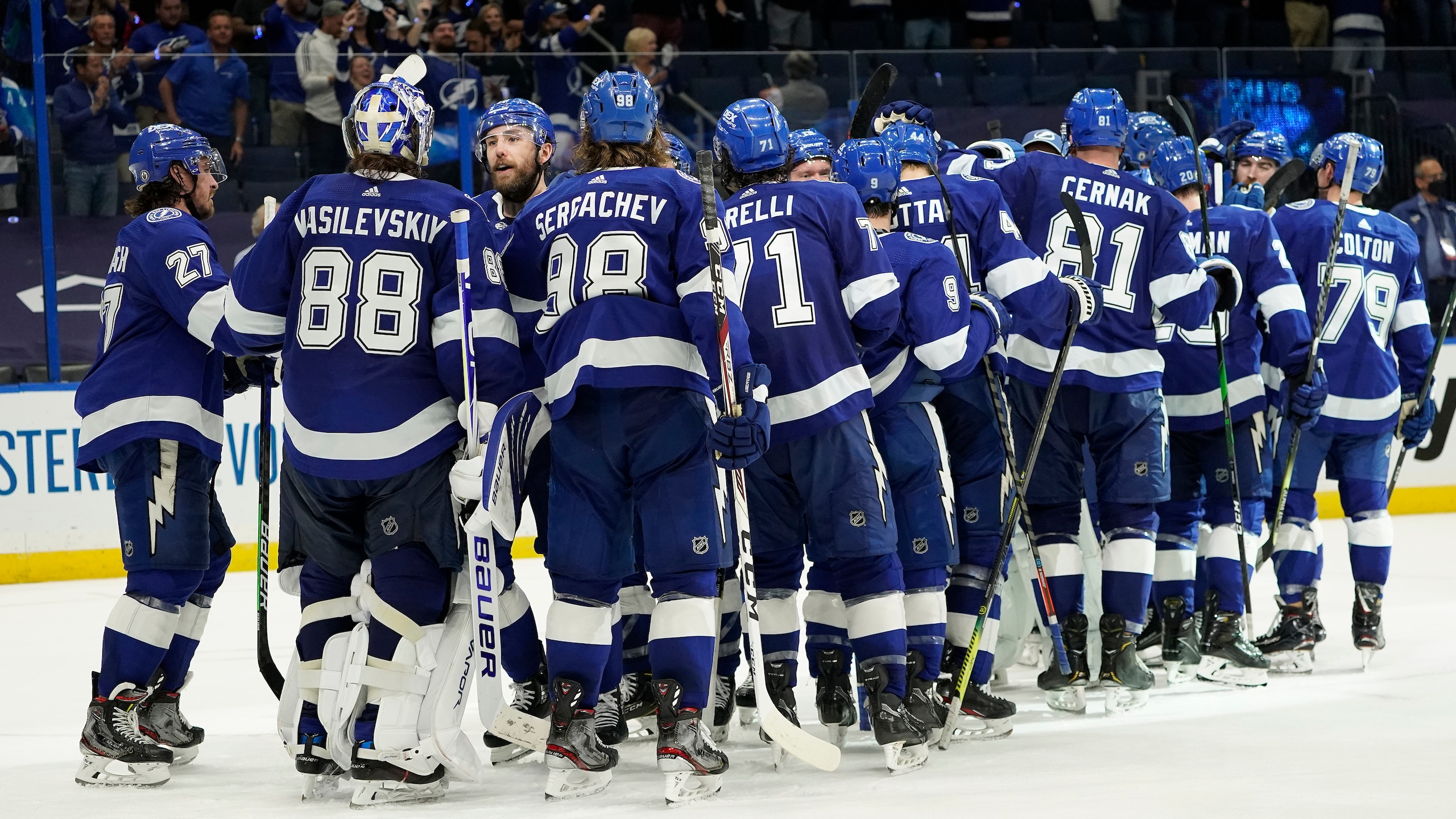 The Tampa Bay Lightning celebrate after eliminating the Florida Panthers in Game 6 of an NHL hockey Stanley Cup first-round playoff series Wednesday, May 26, 2021, in Tampa, Fla. (AP Photo/Chris O'Meara)
