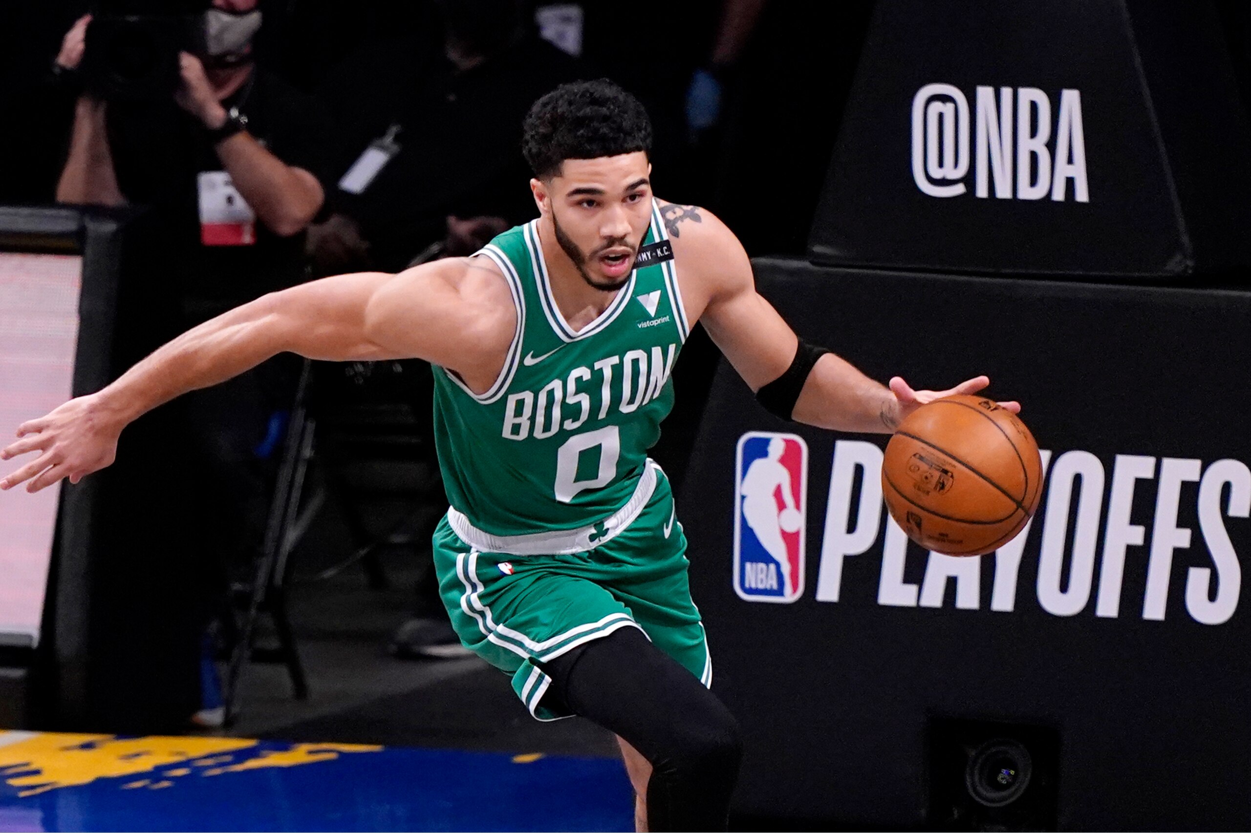 Boston Celtics forward Jayson Tatum (0) runs up court with the ball during the first quarter of Game 2 of an NBA basketball first-round playoff series against the Brooklyn Nets, Tuesday, May 25, 2021, in New York. (AP Photo/Kathy Willens)