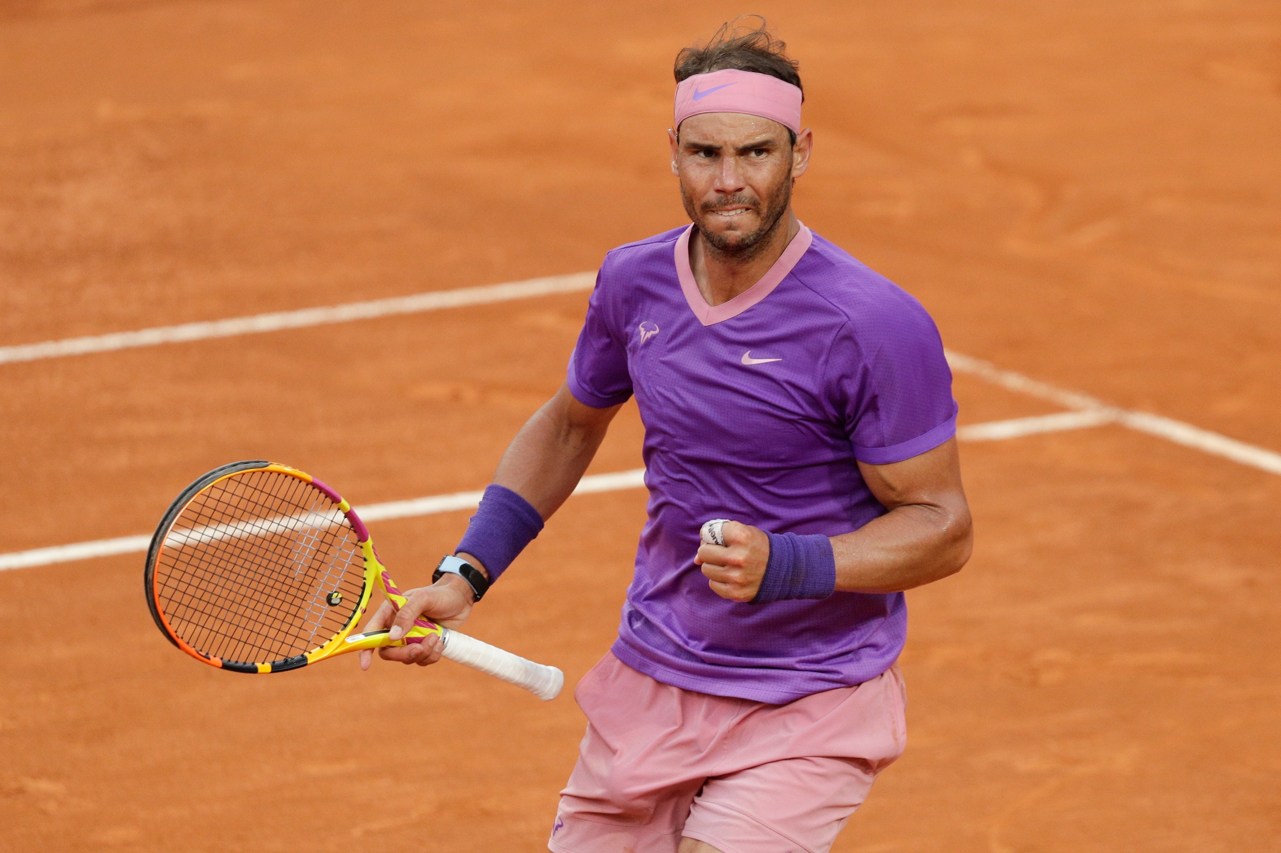 Spain's Rafael Nadal reacts after winning a point to Serbia's Novak Djokovic during their final match at the Italian Open tennis tournament, in Rome, Sunday, May 16, 2021. (AP Photo/Gregorio Borgia)