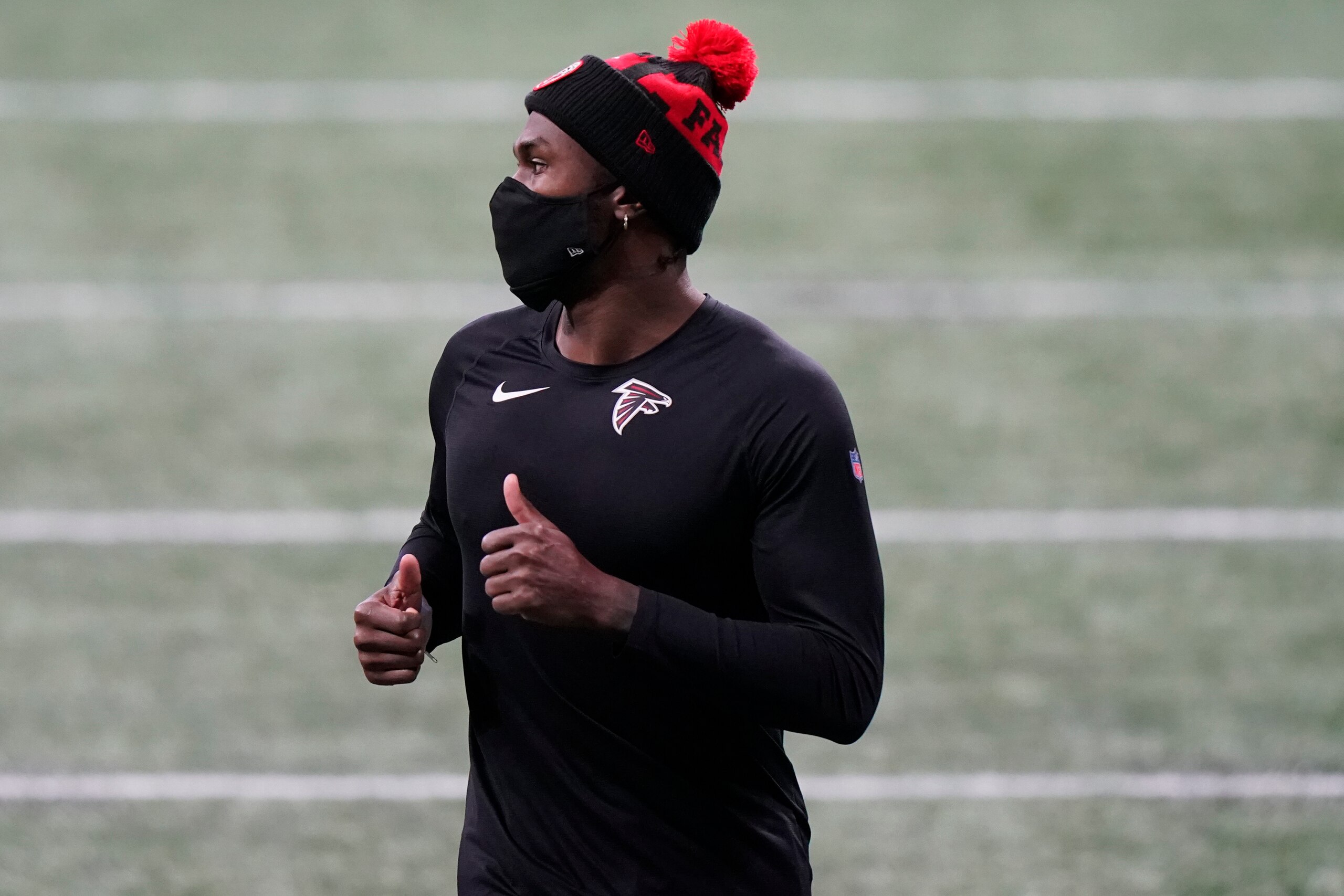 Atlanta Falcons wide receiver Julio Jones walks on the turf before the first half of an NFL football game between the Atlanta Falcons and the Tampa Bay Buccaneers, Sunday, Dec. 20, 2020, in Atlanta. (AP Photo/Brynn Anderson) Atlanta Falcons wide receiver Julio Jones walks on the turf before the first half of an NFL football game between the Atlanta Falcons and the Tampa Bay Buccaneers, Sunday, Dec. 20, 2020, in Atlanta. (AP Photo/Brynn Anderson)