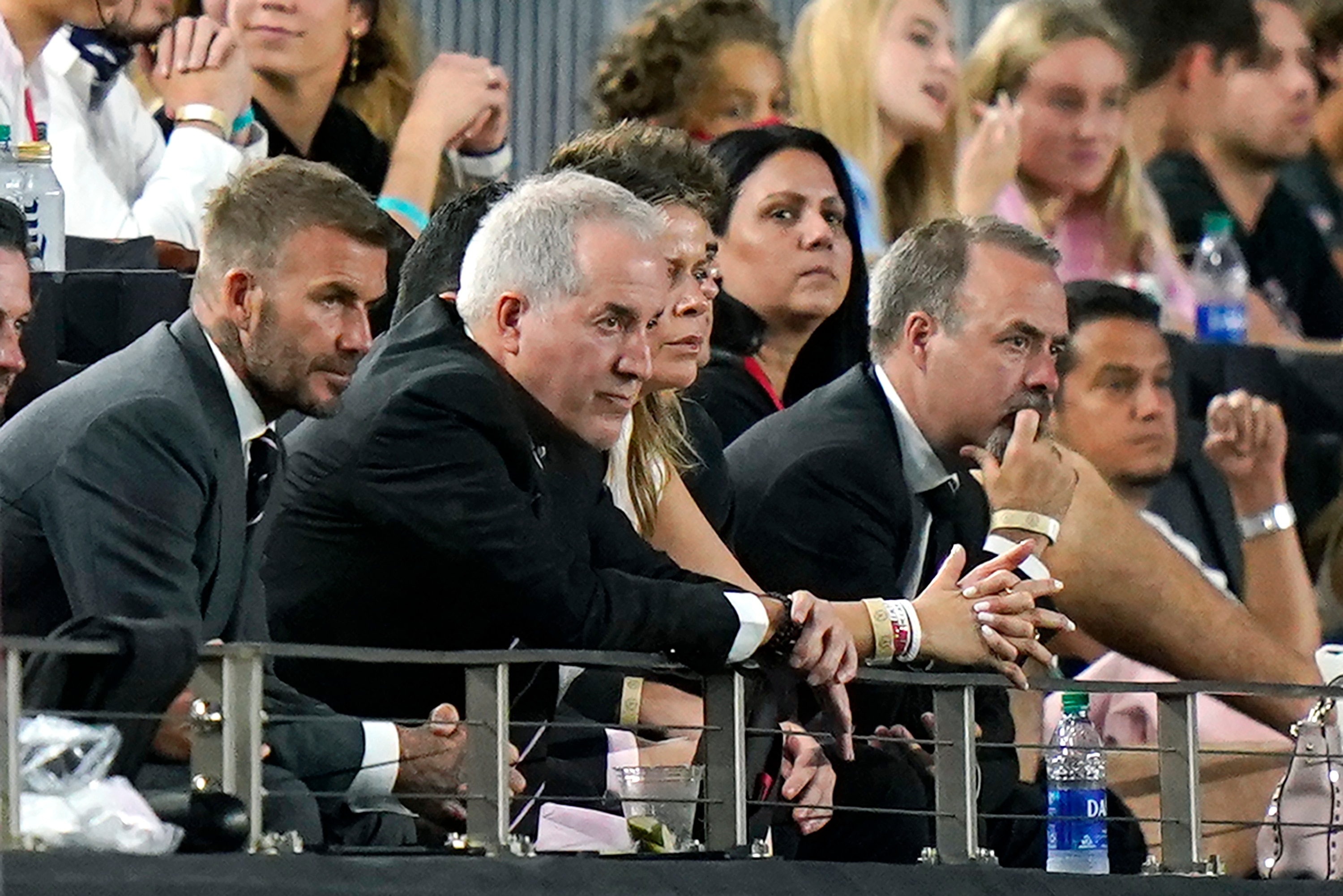 David Beckham, left, owner and president of soccer operations for Inter Miami, and Jorge Mas, second from left, managing owner, watch during the first half of the team's MLS soccer match against Montreal, Wednesday, May 12, 2021, in Fort Lauderdale, Fla. (AP Photo/Lynne Sladky)