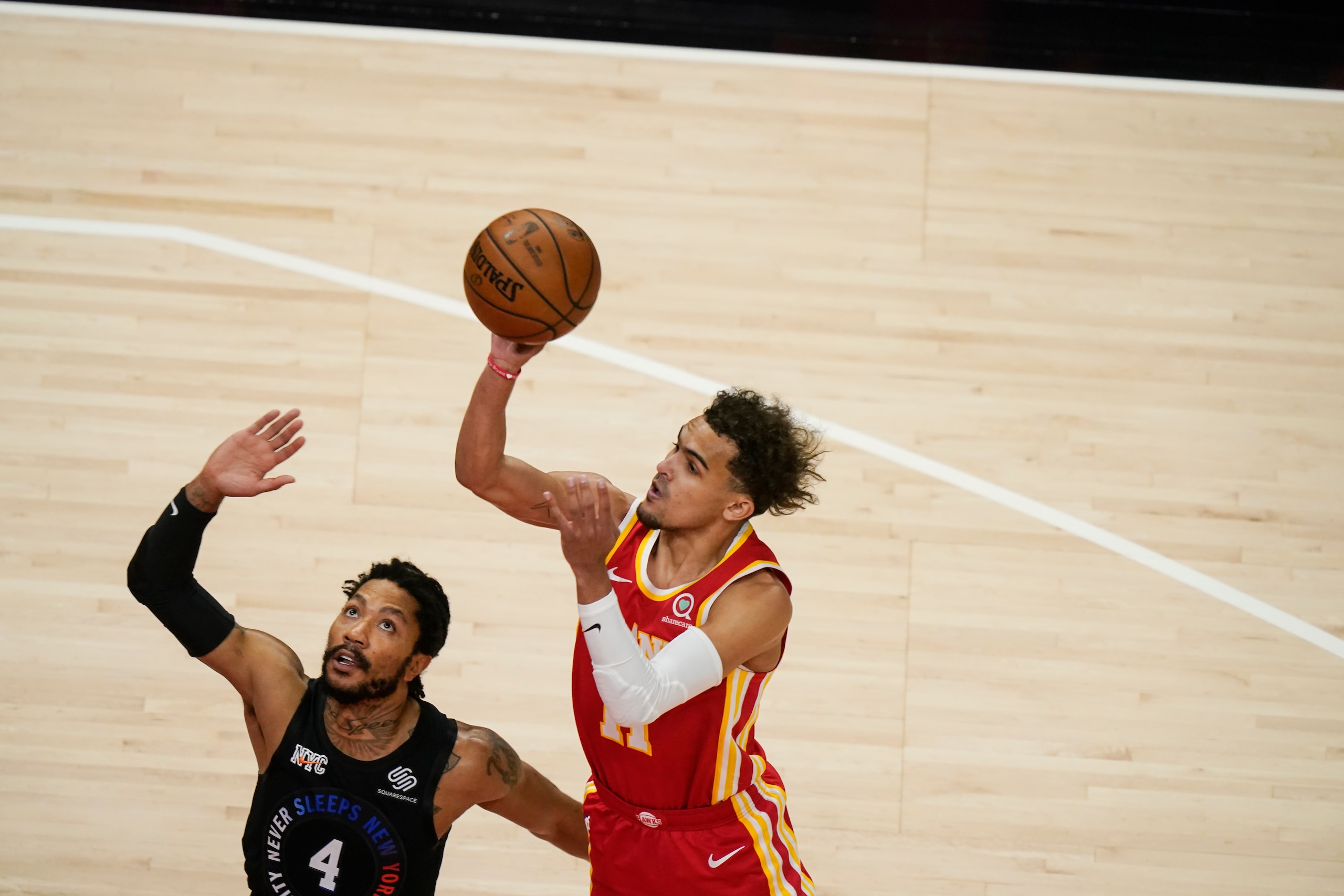 Atlanta Hawks' Trae Young (11) shoots against New York Knicks' Derrick Rose (4) during the first half in Game 3 of an NBA basketball first-round playoff series Friday, May 28, 2021, in Atlanta. (AP Photo/Brynn Anderson) Atlanta Hawks' Trae Young (11) shoots against New York Knicks' Derrick Rose (4) during the first half in Game 3 of an NBA basketball first-round playoff series Friday, May 28, 2021, in Atlanta. (AP Photo/Brynn Anderson)