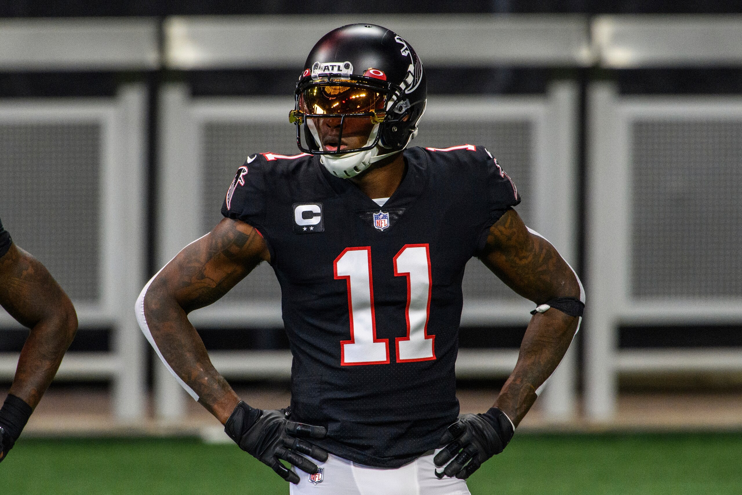 FILE - In this Sunday, Dec. 6, 2020, file photo, Atlanta Falcons wide receiver Julio Jones (11) warms up before an NFL football game against the New Orleans Saints in Atlanta. The Atlanta Falcons began their offseason training program Tuesday, May 25, 2021, without longtime star receiver Julio Jones, who apparently has no intention of returning to a rebuilding team that is still struggling to get under the salary cap. (AP Photo/Danny Karnik, File)
