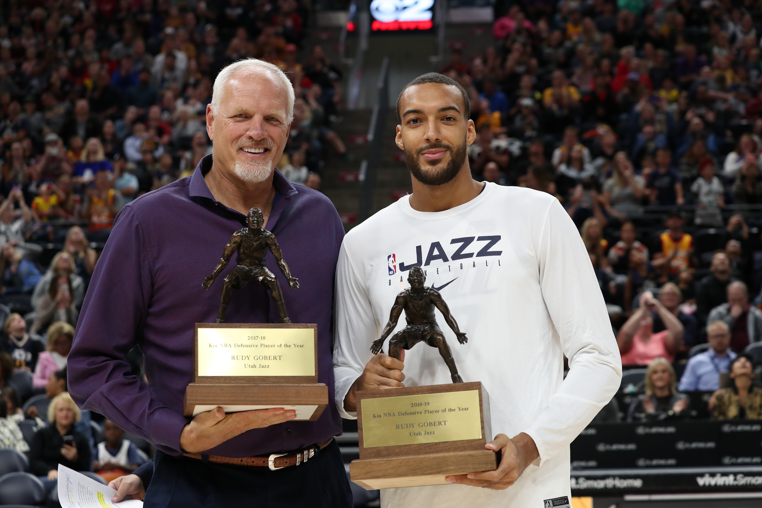 SALT LAKE CITY, UT - OCTOBER 04: NBA Legend Mark Eaton presents Rudy Gobert #27 of the Utah Jazz 2018-19 KIA NBA Defensive Player of the Year during the meet the team event at vivint.SmartHome Arena on October 04, 2019 in Salt Lake City, Utah. NOTE TO USER: User expressly acknowledges and agrees that, by downloading and or using this Photograph, User is consenting to the terms and conditions of the Getty Images License Agreement. Mandatory Copyright Notice: Copyright 2019 NBAE (Photo by Melissa Majchrzak/NBAE via Getty Images)