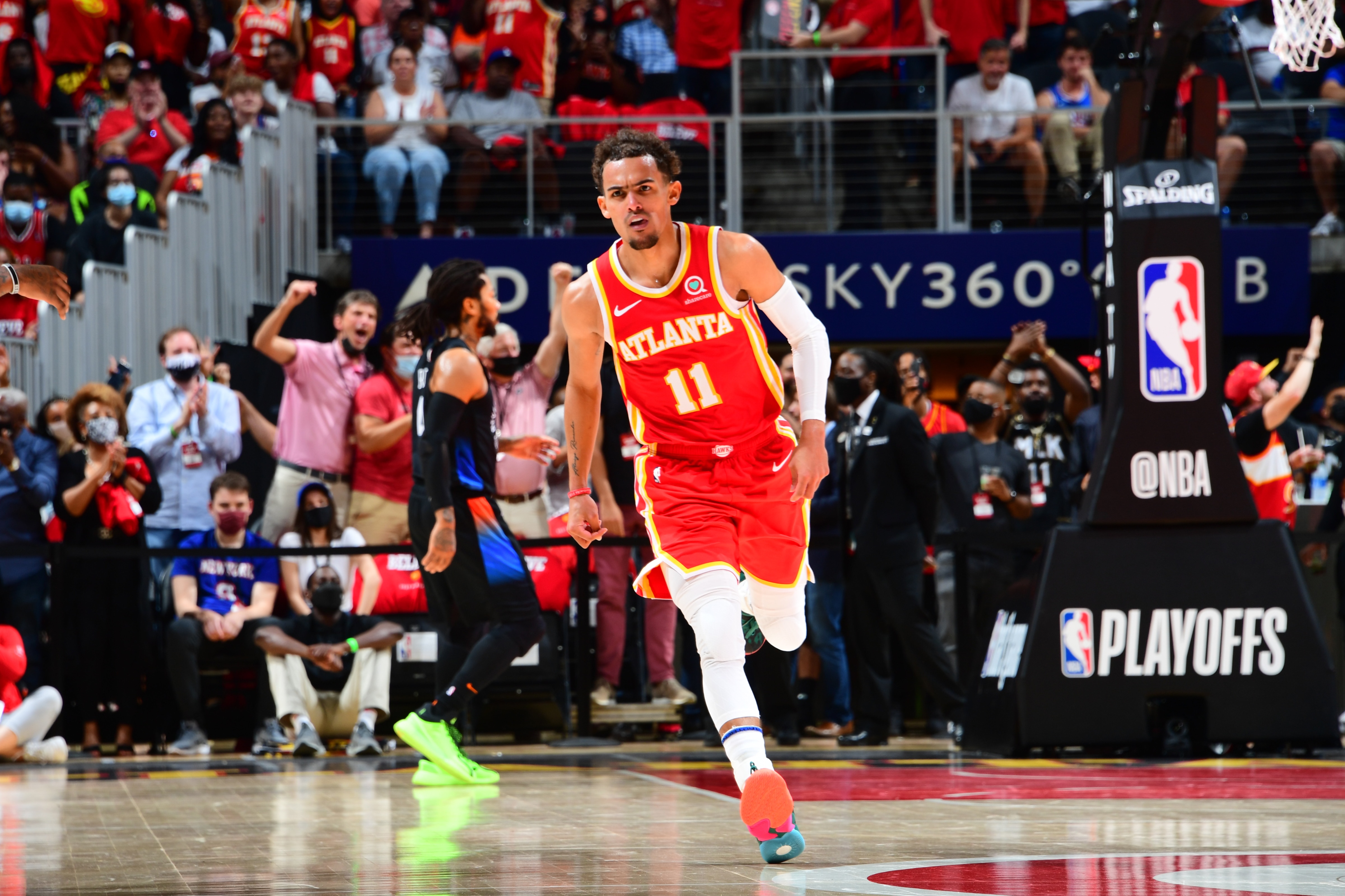 ATLANTA, GA - MAY 28: Trae Young #11 of the Atlanta Hawks looks on during the game against the New York Knicks during Round 1, Game 3 of the 2021 NBA Playoffs on May 28, 2021 at State Farm Arena in Atlanta, Georgia.  NOTE TO USER: User expressly acknowledges and agrees that, by downloading and/or using this Photograph, user is consenting to the terms and conditions of the Getty Images License Agreement. Mandatory Copyright Notice: Copyright 2021 NBAE (Photo by Scott Cunningham/NBAE via Getty Images)