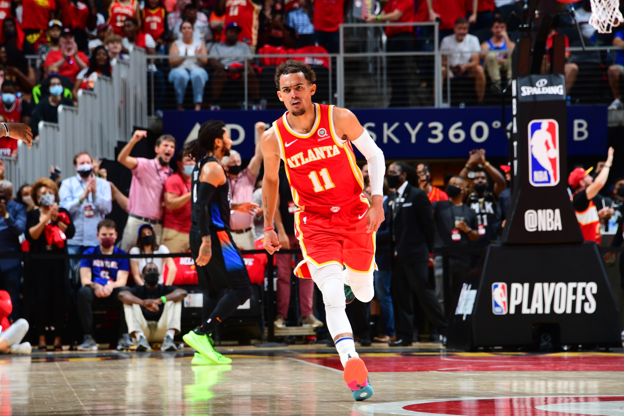 ATLANTA, GA - MAY 28: Trae Young #11 of the Atlanta Hawks looks on during the game against the New York Knicks during Round 1, Game 3 of the 2021 NBA Playoffs on May 28, 2021 at State Farm Arena in Atlanta, Georgia.  NOTE TO USER: User expressly acknowledges and agrees that, by downloading and/or using this Photograph, user is consenting to the terms and conditions of the Getty Images License Agreement. Mandatory Copyright Notice: Copyright 2021 NBAE (Photo by Scott Cunningham/NBAE via Getty Images)
