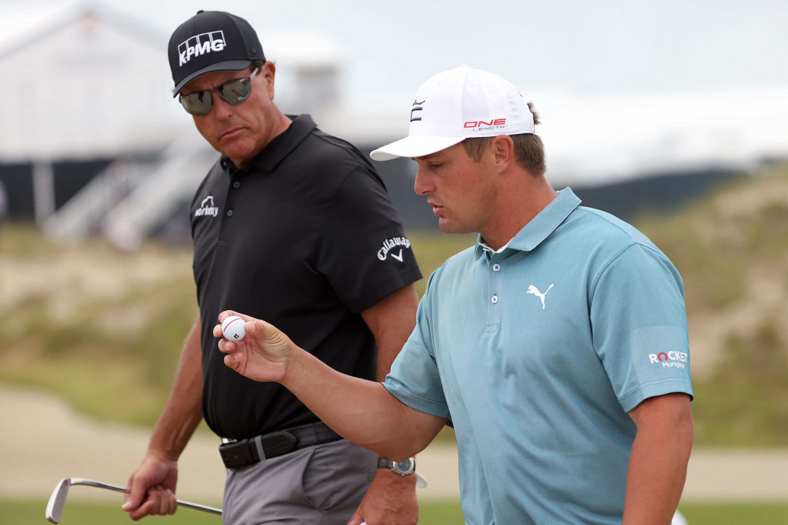 KIAWAH ISLAND, SOUTH CAROLINA - MAY 19: Phil Mickelson of the United States and Bryson DeChambeau of the United States walk off the tenth hole during a practice round prior to the 2021 PGA Championship at Kiawah Island Resort's Ocean Course on May 19, 2021 in Kiawah Island, South Carolina. (Photo by Jamie Squire/Getty Images)