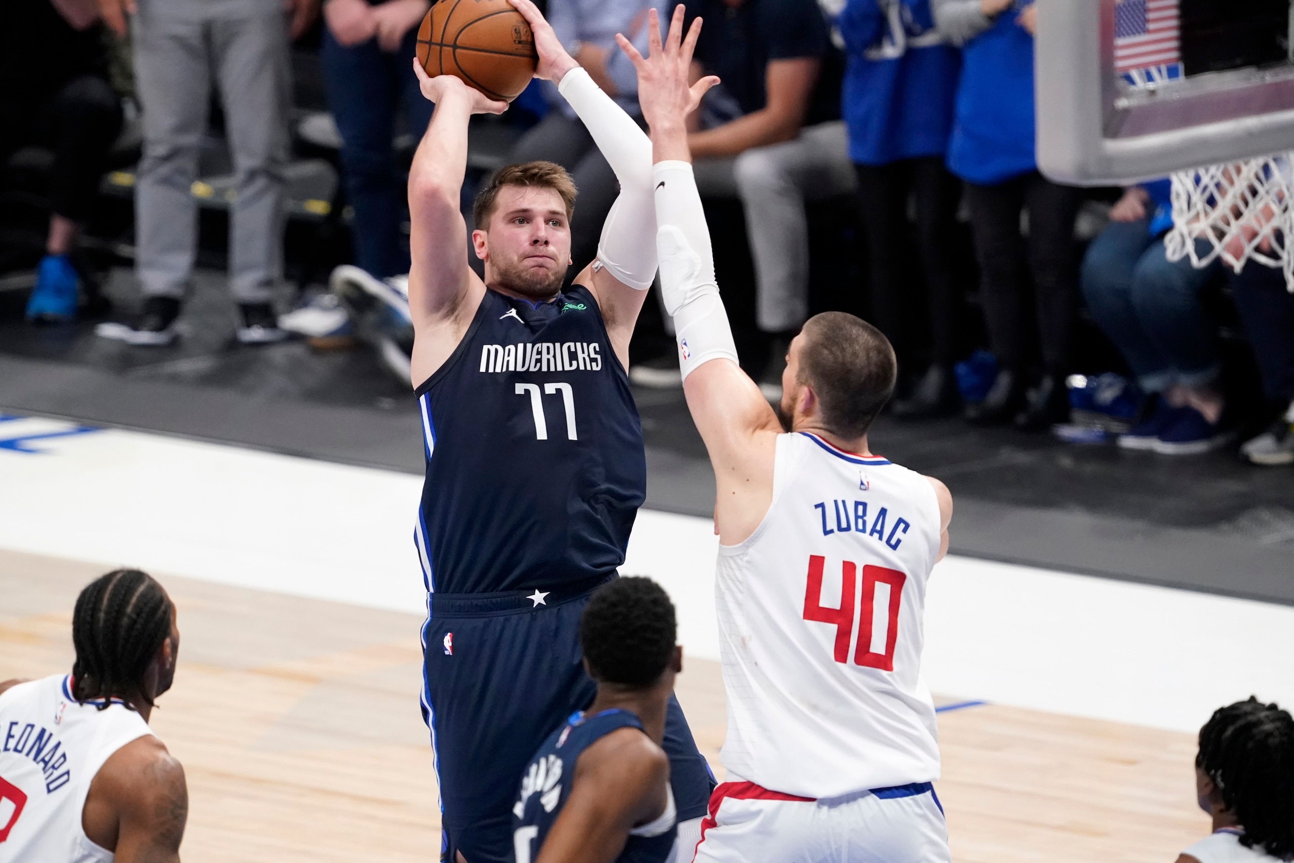Dallas Mavericks guard Luka Doncic (77) takes a shot as Los Angeles Clippers center Ivica Zubac (40) defends in the second half in Game 3 of an NBA basketball first-round playoff series in Dallas, Friday, May 28, 2021. (AP Photo/Tony Gutierrez)