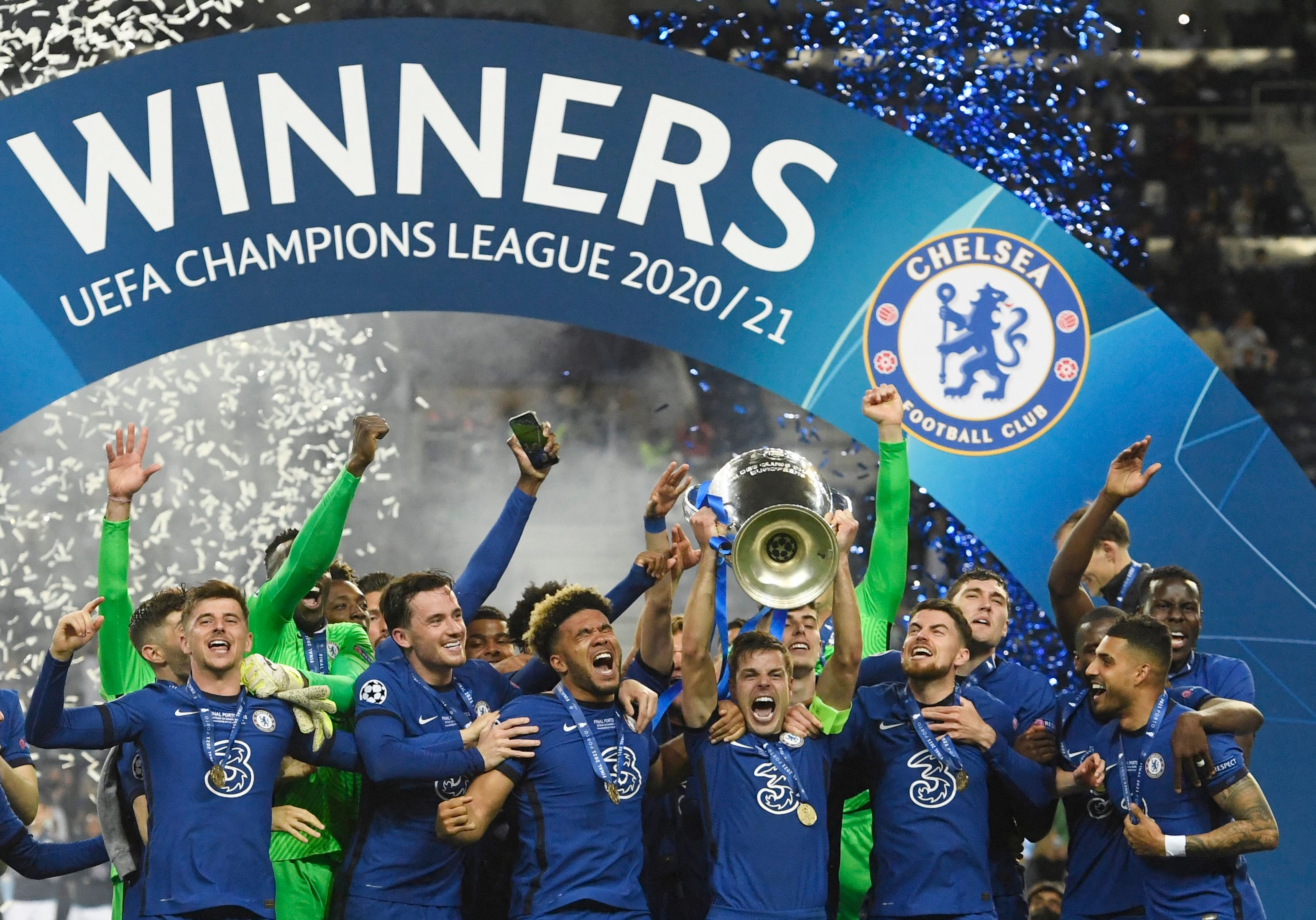 Chelsea's Spanish defender Cesar Azpilicueta (C) celebrates with the trophy after winning the UEFA Champions League final football match at the Dragao stadium in Porto on May 29, 2021. (Photo by PIERRE-PHILIPPE MARCOU / POOL / AFP) (Photo by PIERRE-PHILIPPE MARCOU/POOL/AFP via Getty Images)