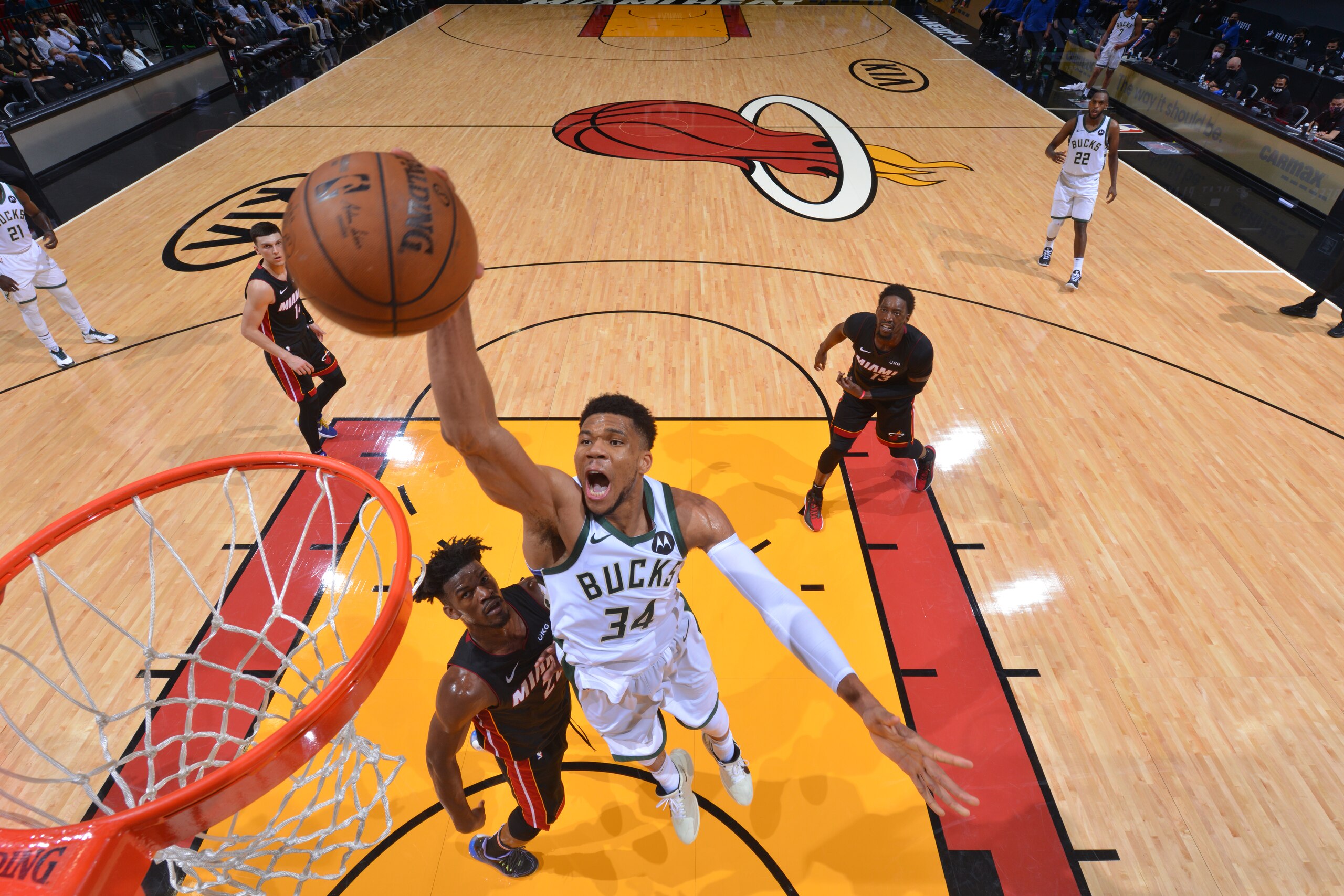 MIAMI, FL - MAY 29: Giannis Antetokounmpo #34 of the Milwaukee Bucks dunks the ball against Jimmy Butler #22 of the Miami Heat during Round One Game Four of the Eastern Conference Playoffs on May 29, 2021 at AmericanAirlines Arena in Miami, Florida. NOTE TO USER: User expressly acknowledges and agrees that, by downloading and/or using this Photograph, user is consenting to the terms and conditions of the Getty Images License Agreement. Mandatory Copyright Notice: Copyright 2021 NBAE (Photo by Jesse D. Garrabrant/NBAE via Getty Images)