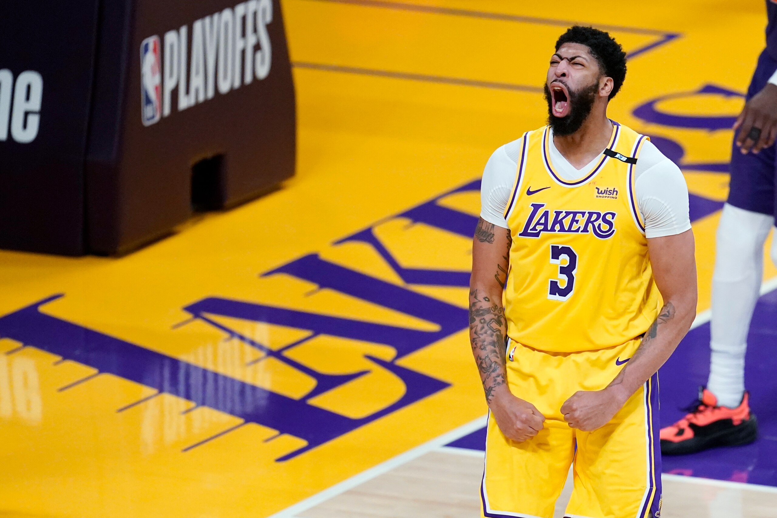 Los Angeles Lakers forward Anthony Davis celebrates after scoring during the second half in Game 3 of the team's NBA basketball first-round playoff series against the Phoenix Suns on Thursday, May 27, 2021, in Los Angeles. (AP Photo/Marcio Jose Sanchez)