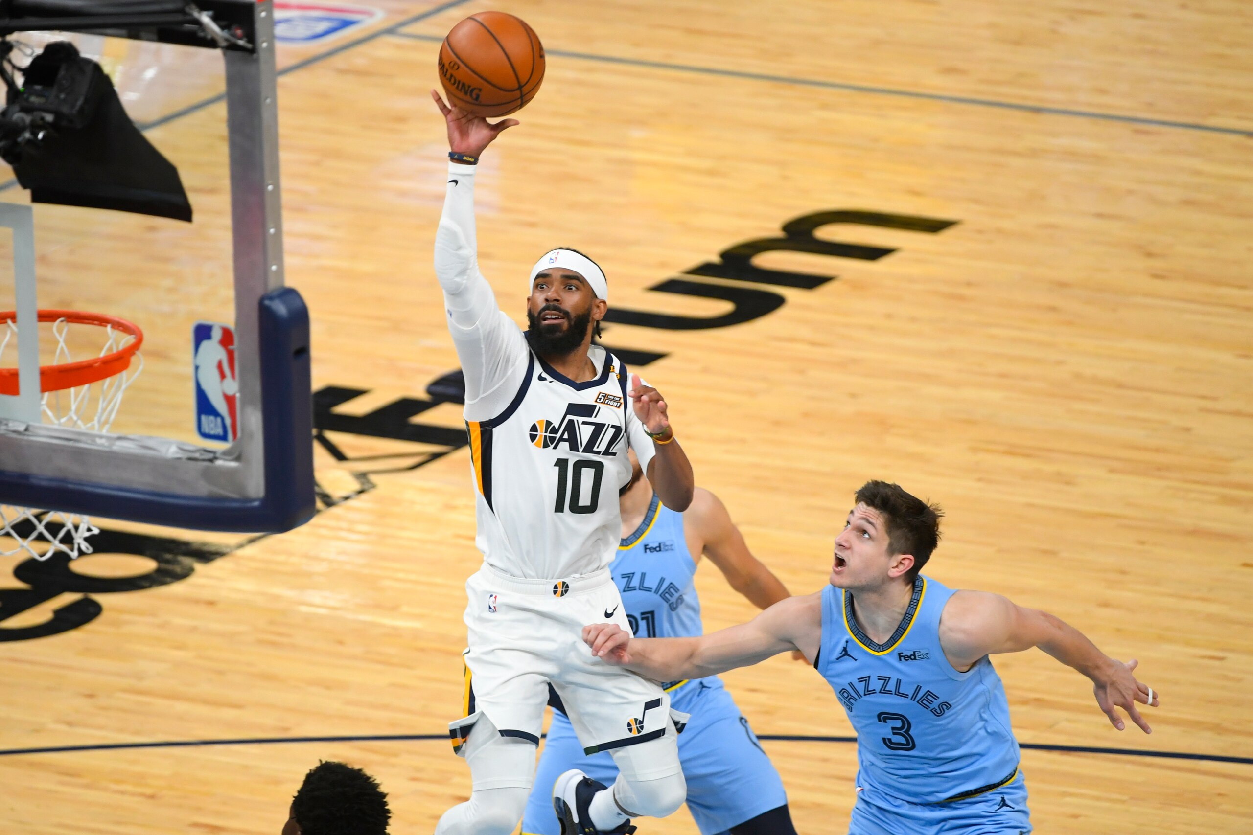Utah Jazz guard Mike Conley (10) shoots as Memphis Grizzlies guard Grayson Allen (3) defends during the second half of Game 3 of an NBA basketball first-round playoff series Saturday, May 29, 2021, in Memphis, Tenn. (AP Photo/John Amis) Utah Jazz guard Mike Conley (10) shoots as Memphis Grizzlies guard Grayson Allen (3) defends during the second half of Game 3 of an NBA basketball first-round playoff series Saturday, May 29, 2021, in Memphis, Tenn. (AP Photo/John Amis)