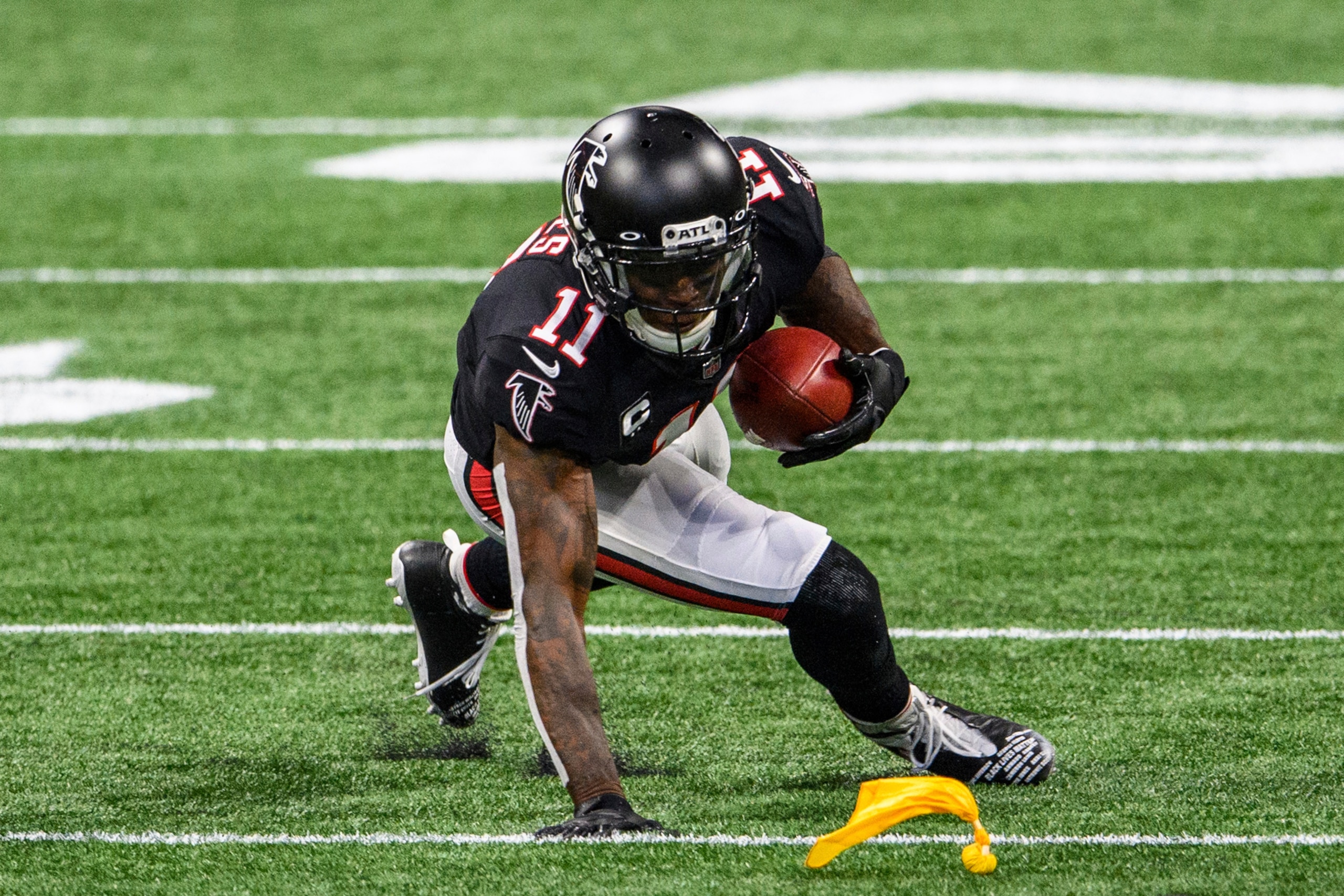 Atlanta Falcons wide receiver Julio Jones (11) catches a pass for a first down during the first half of an NFL football game against the New Orleans Saints, Sunday, Dec. 6, 2020, in Atlanta. (AP Photo/Danny Karnik)