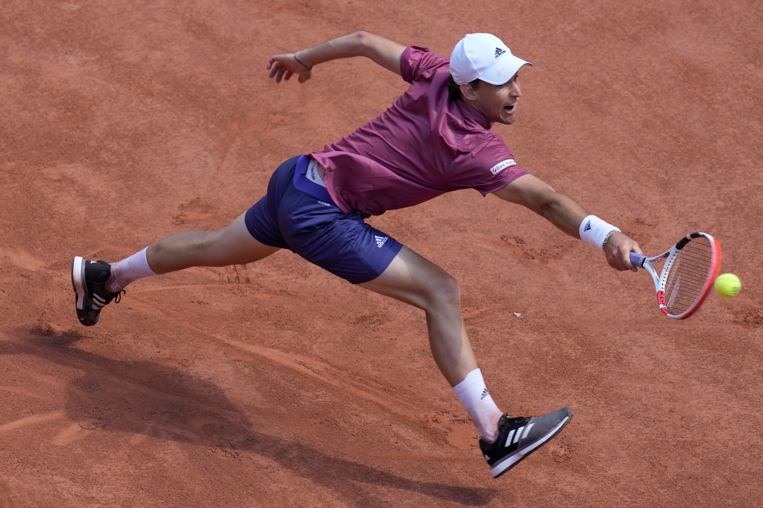 Austria's Dominic Thiem returns the ball to Spain's Pablo Andujar during their first round match of the French Open tennis tournament at the Roland Garros stadium Sunday, May 30, 2021 in Paris. (AP Photo/Christophe Ena) Austria's Dominic Thiem returns the ball to Spain's Pablo Andujar during their first round match of the French Open tennis tournament at the Roland Garros stadium Sunday, May 30, 2021 in Paris. (AP Photo/Christophe Ena)
