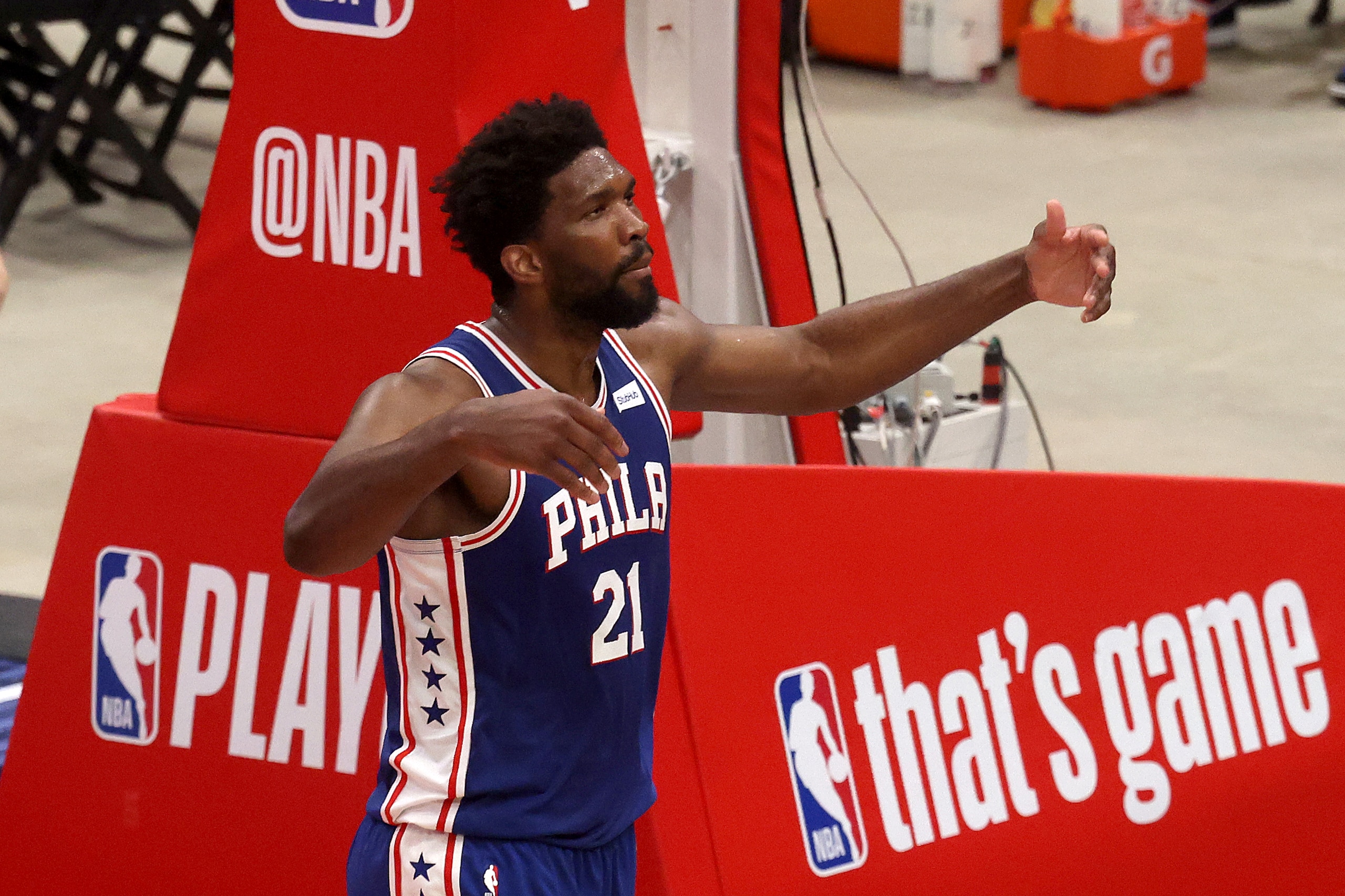 WASHINGTON, DC - MAY 29: Joel Embiid #21 of the Philadelphia 76ers reacts after scoring against the Washington Wizards in the first half during Game Three of the Eastern Conference first round series at Capital One Arena on May 29, 2021 in Washington, DC. NOTE TO USER: User expressly acknowledges and agrees that, by downloading and or using this photograph, User is consenting to the terms and conditions of the Getty Images License Agreement. (Photo by Rob Carr/Getty Images)