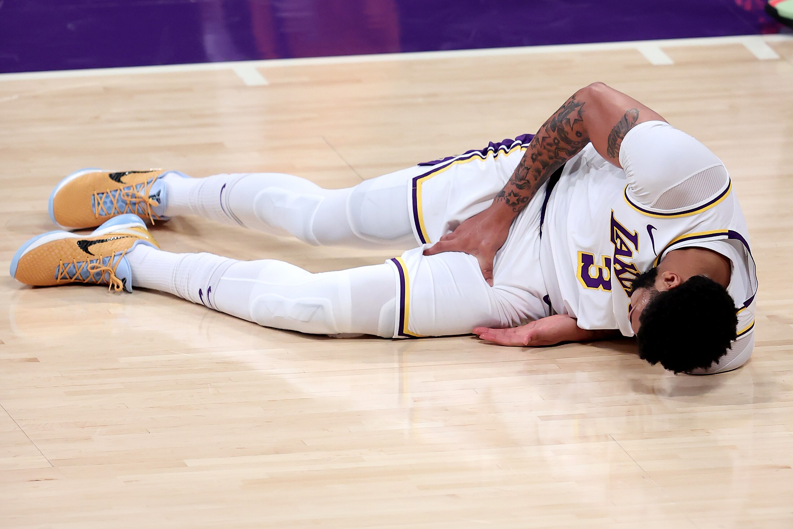 LOS ANGELES, CALIFORNIA - MAY 30: Anthony Davis #3 of the Los Angeles Lakers grabs his thigh after falling during the first half of Game Four of the Western Conference first-round playoff series against the Phoenix Suns at Staples Center on May 30, 2021 in Los Angeles, California. NOTE TO USER: User expressly acknowledges and agrees that, by downloading and or using this photograph, User is consenting to the terms and conditions of the Getty Images License Agreement. (Photo by Sean M. Haffey/Getty Images) LOS ANGELES, CALIFORNIA - MAY 30: Anthony Davis #3 of the Los Angeles Lakers grabs his thigh after falling during the first half of Game Four of the Western Conference first-round playoff series against the Phoenix Suns at Staples Center on May 30, 2021 in Los Angeles, California. NOTE TO USER: User expressly acknowledges and agrees that, by downloading and or using this photograph, User is consenting to the terms and conditions of the Getty Images License Agreement. (Photo by Sean M. Haffey/Getty Images)