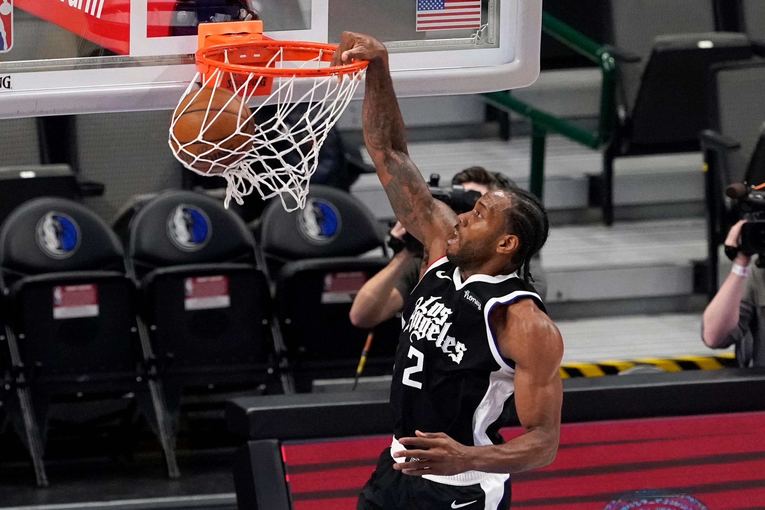 Los Angeles Clippers forward Kawhi Leonard dunks in the first half in Game 4 of an NBA basketball first-round playoff series against the Los Angeles Clippers in Dallas, Sunday, May 30, 2021. (AP Photo/Tony Gutierrez) Los Angeles Clippers forward Kawhi Leonard dunks in the first half in Game 4 of an NBA basketball first-round playoff series against the Los Angeles Clippers in Dallas, Sunday, May 30, 2021. (AP Photo/Tony Gutierrez)
