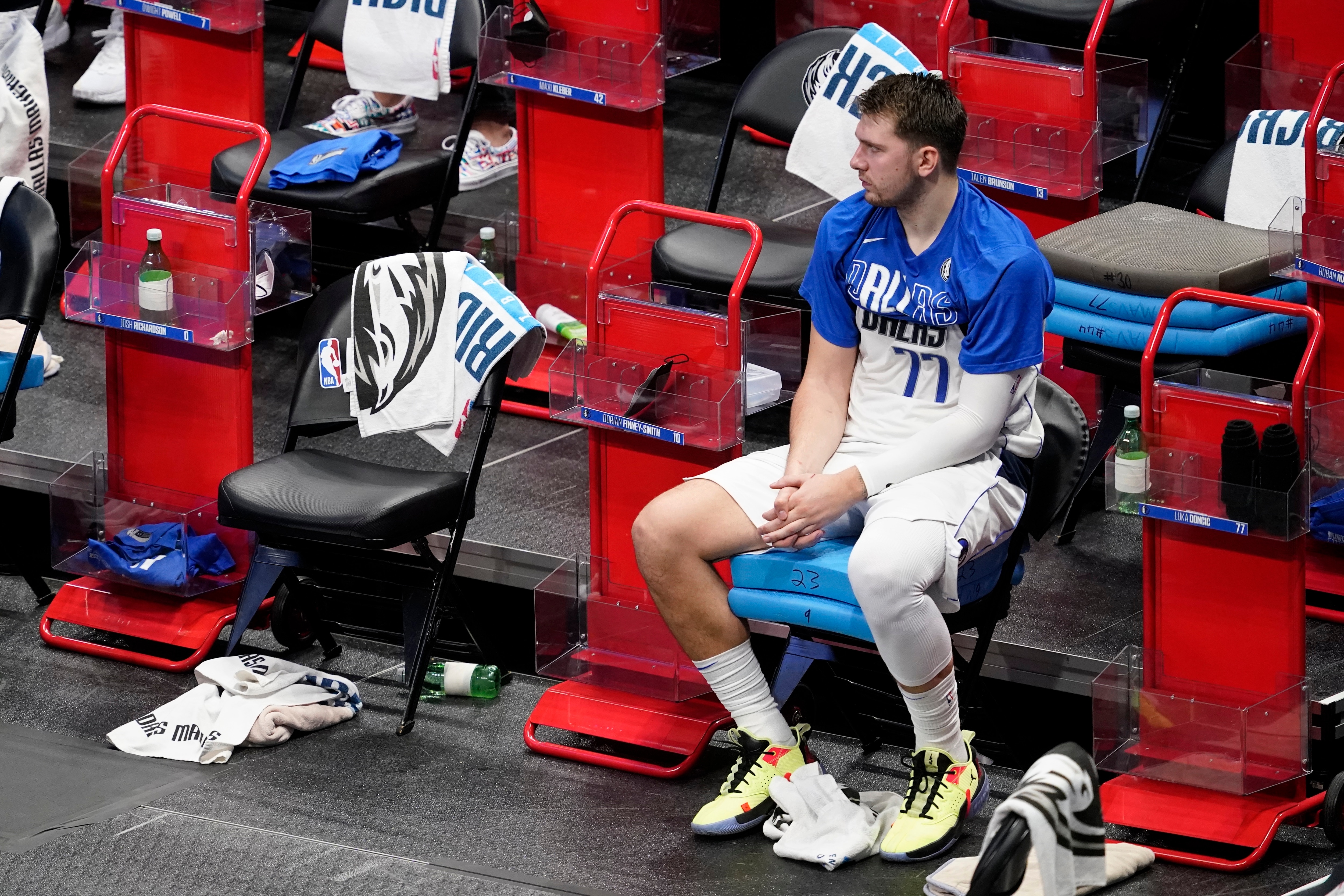 Dallas Mavericks' Luka Doncic sits on the bench in the fourth quarter in Game 4 of an NBA basketball first-round playoff series against the Los Angeles Clippers in Dallas, Sunday, May 30, 2021. (AP Photo/Tony Gutierrez)