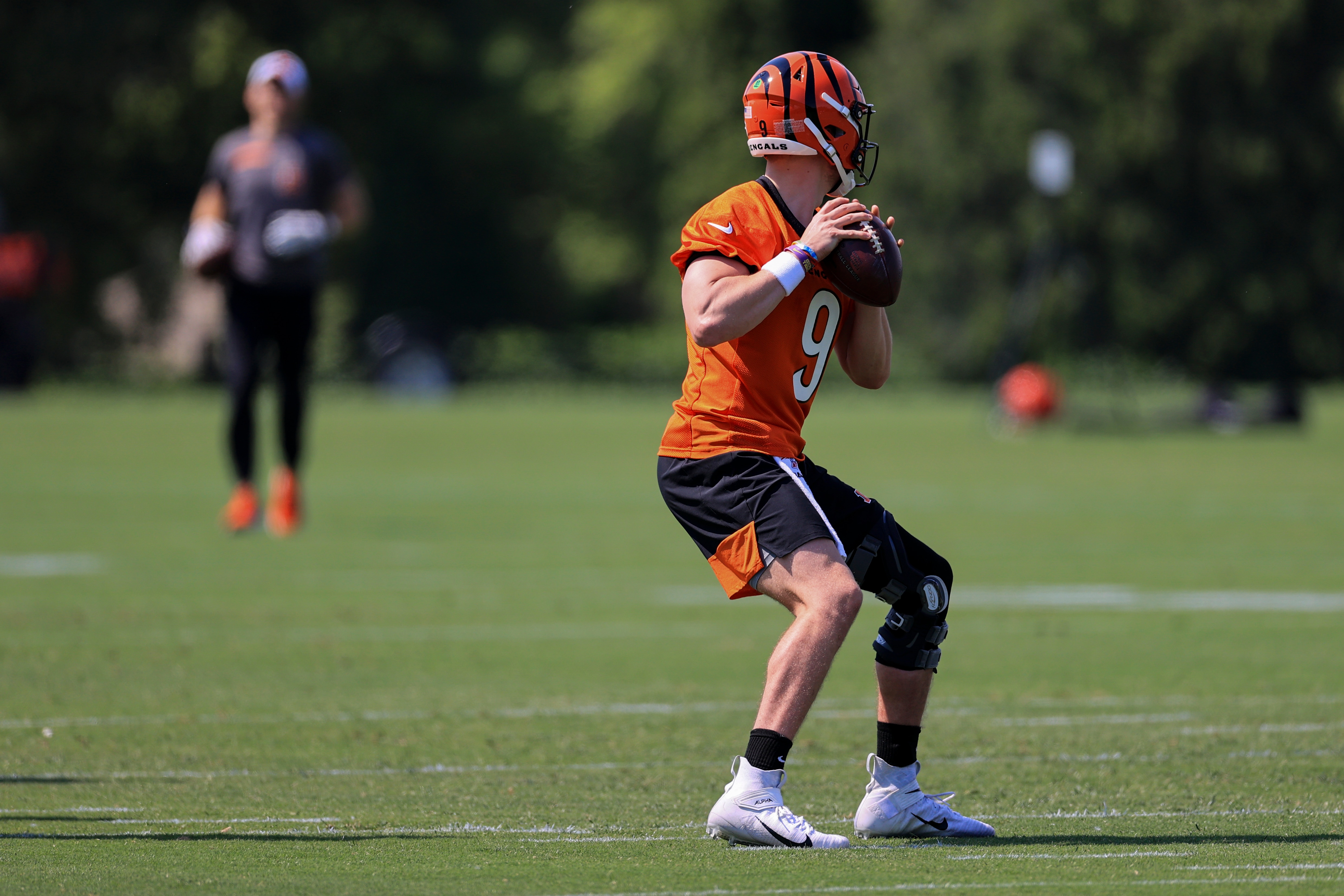 Cincinnati Bengals Joe Burrow throws a pass during an NFL football camp practice in Cincinnati, Tuesday, May 25, 2021. (AP Photo/Aaron Doster)