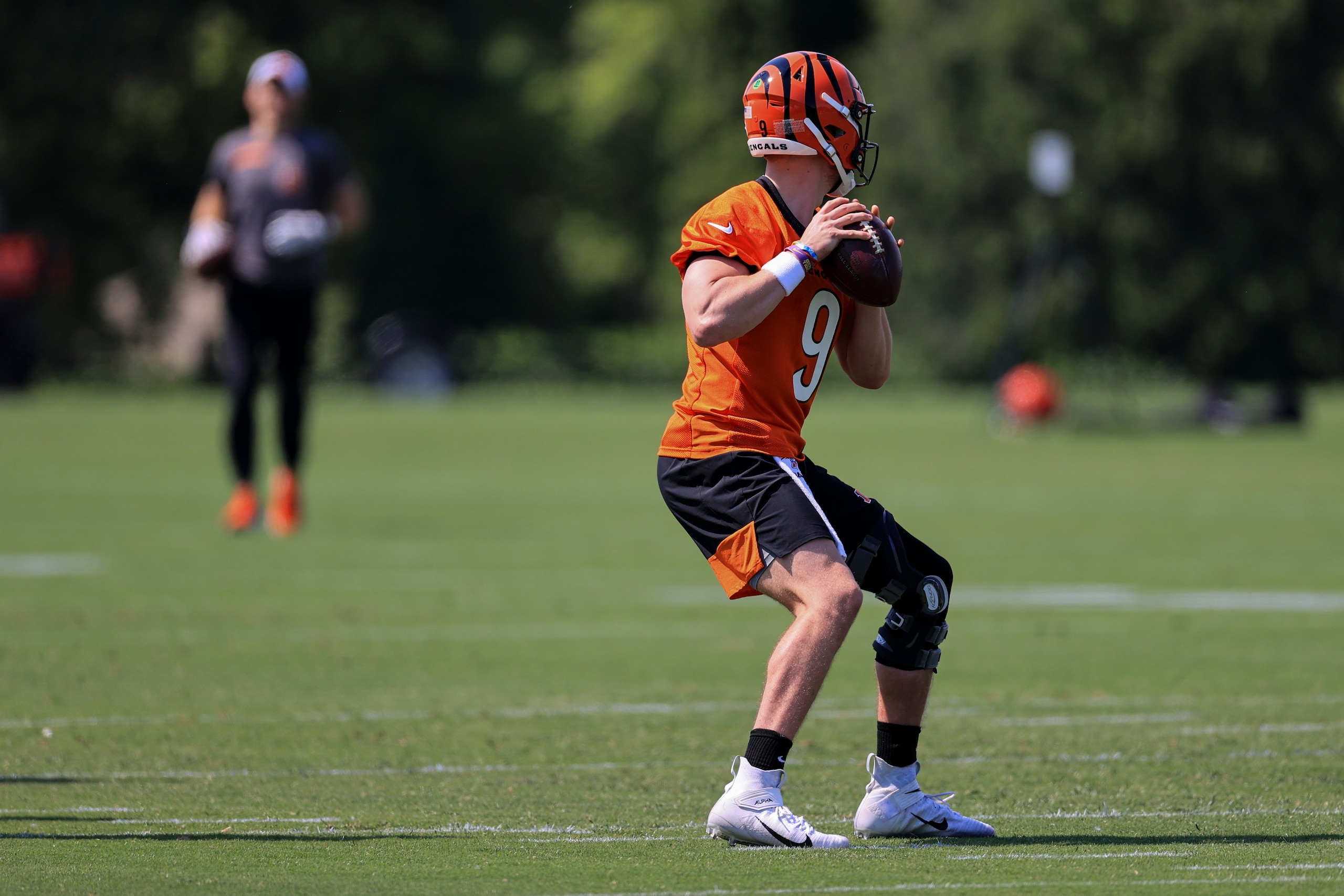 Cincinnati Bengals Joe Burrow throws a pass during an NFL football camp practice in Cincinnati, Tuesday, May 25, 2021. (AP Photo/Aaron Doster)
