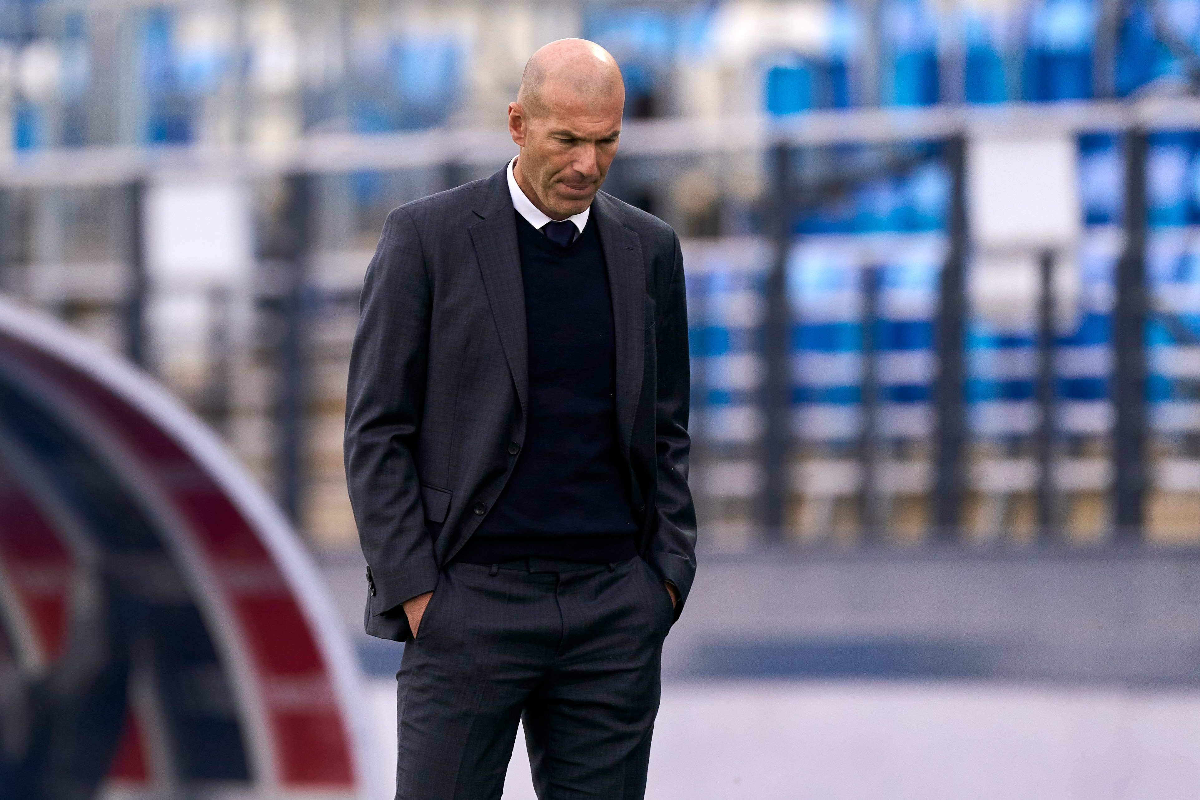 MADRID, SPAIN - MAY 22: Zinedine Zidane head Coach of Real Madrid reacts during the La Liga Santander match between Real Madrid and Villarreal CF at Estadio Alfredo Di Stefano on May 22, 2021 in Madrid, Spain. Sporting stadiums around Spain remain under strict restrictions due to the Coronavirus Pandemic as Government social distancing laws prohibit fans inside venues resulting in games being played behind closed doors (Photo by Diego Souto/Quality Sport Images/Getty Images)