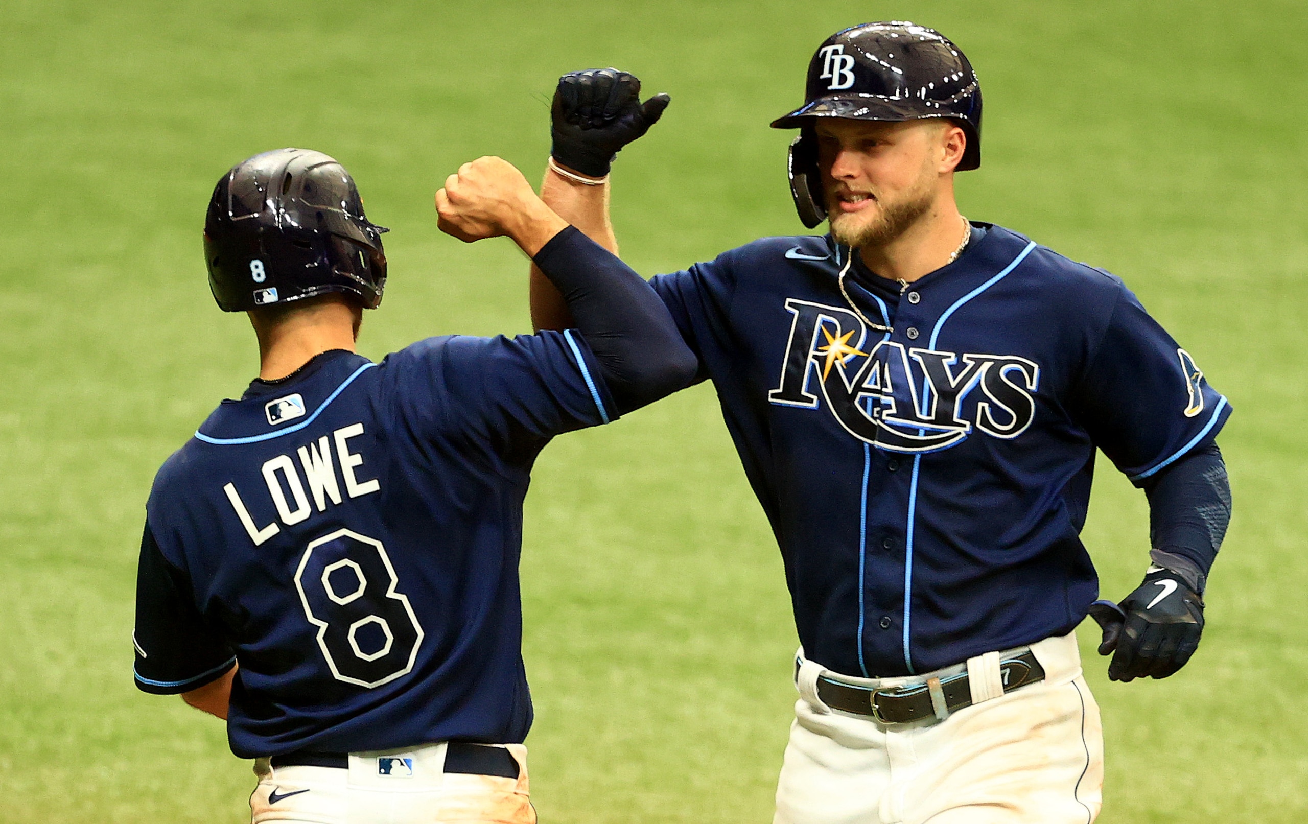 ST PETERSBURG, FLORIDA - MAY 27: Austin Meadows #17 of the Tampa Bay Rays is congratulated by Brandon Lowe #8 after a two run home run in the third inning during a game against the Kansas City Royals at Tropicana Field on May 27, 2021 in St Petersburg, Florida. (Photo by Mike Ehrmann/Getty Images)