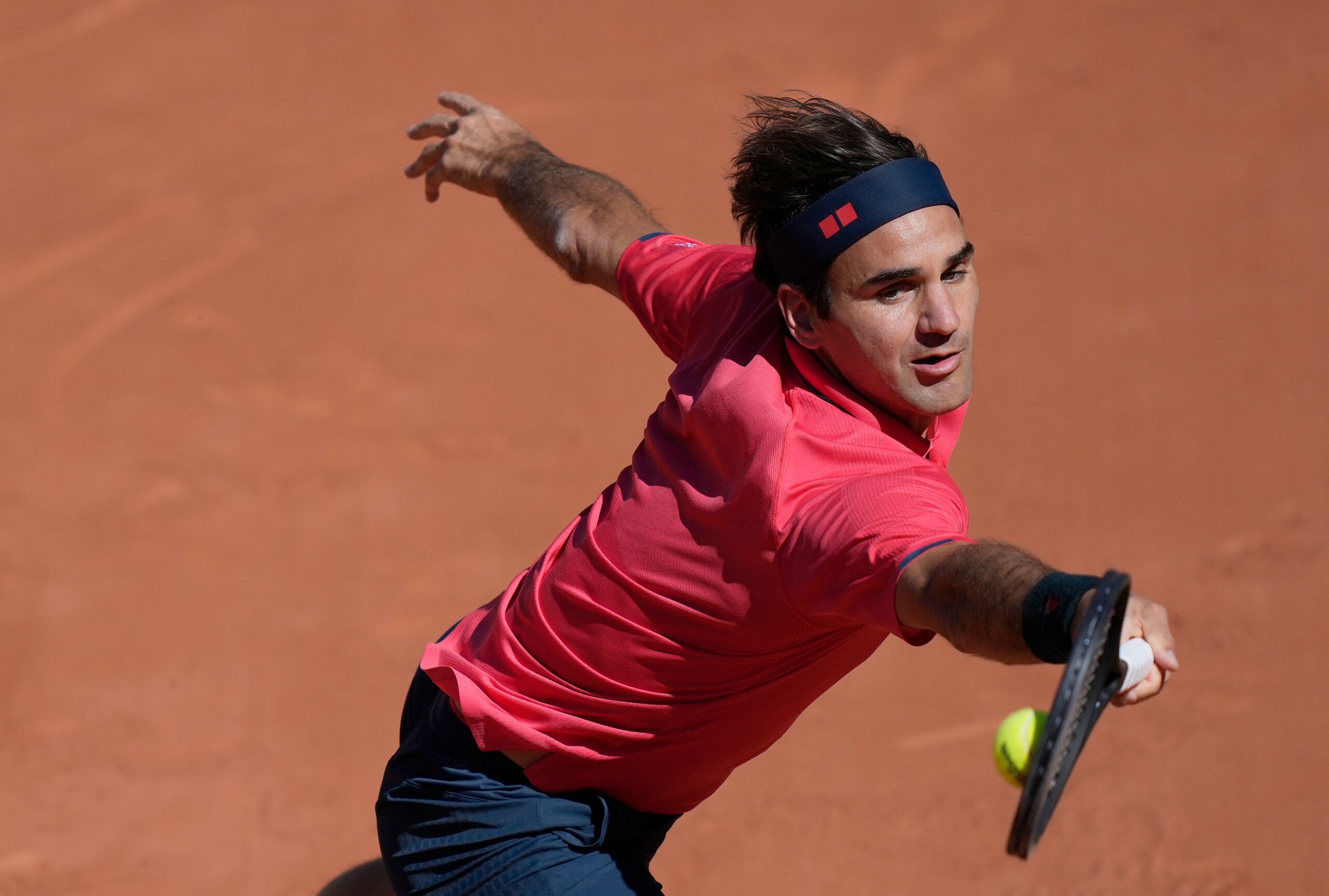 Switzerland's Roger Federer plays a return to Uzbekistan's Denis Istomin during their first round match on day two of the French Open tennis tournament at Roland Garros in Paris, France, Monday, May 31, 2021. (AP Photo/Thibault Camus)