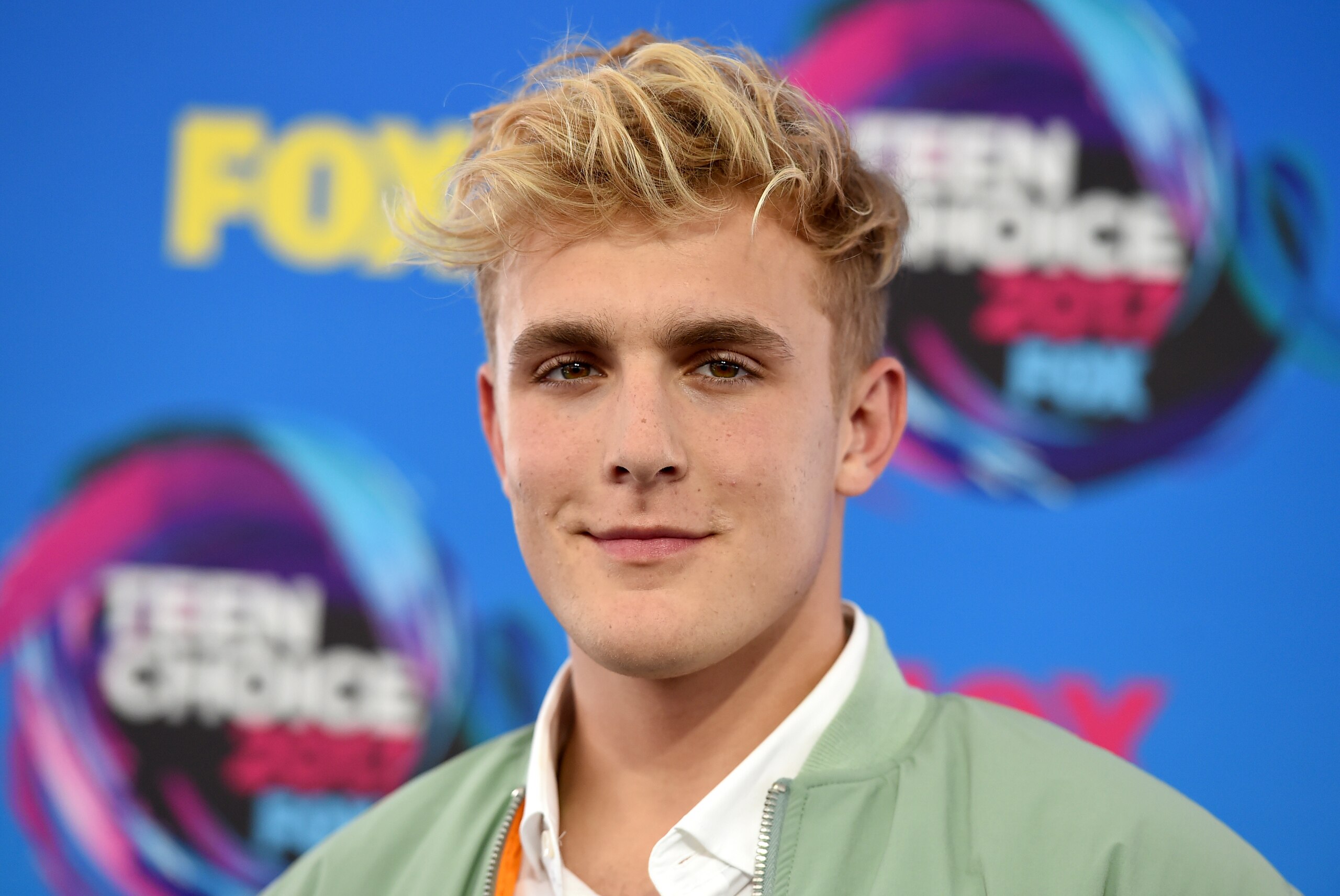 FILE - Internet personality Jake Paul arrives at the Teen Choice Awards in Los Angeles on Aug. 13, 2017. FBI agents including a SWAT team have raided the apparent home of YouTube star Jake Paul. FBI spokeswoman Laura Eimiller says agents executed a search warrant Wednesday at the Calabasas, California mansion in connection with an ongoing investigation. She could not say what the probe is about or who the target was. Helicopter video from local TV news showed agents gathering guns from the home that can frequently be seen on Paul's YouTube channel, which has over 20 million followers. (Photo by Jordan Strauss/Invision/AP, File) FILE - Internet personality Jake Paul arrives at the Teen Choice Awards in Los Angeles on Aug. 13, 2017. FBI agents including a SWAT team have raided the apparent home of YouTube star Jake Paul. FBI spokeswoman Laura Eimiller says agents executed a search warrant Wednesday at the Calabasas, California mansion in connection with an ongoing investigation. She could not say what the probe is about or who the target was. Helicopter video from local TV news showed agents gathering guns from the home that can frequently be seen on Paul's YouTube channel, which has over 20 million followers. (Photo by Jordan Strauss/Invision/AP, File)