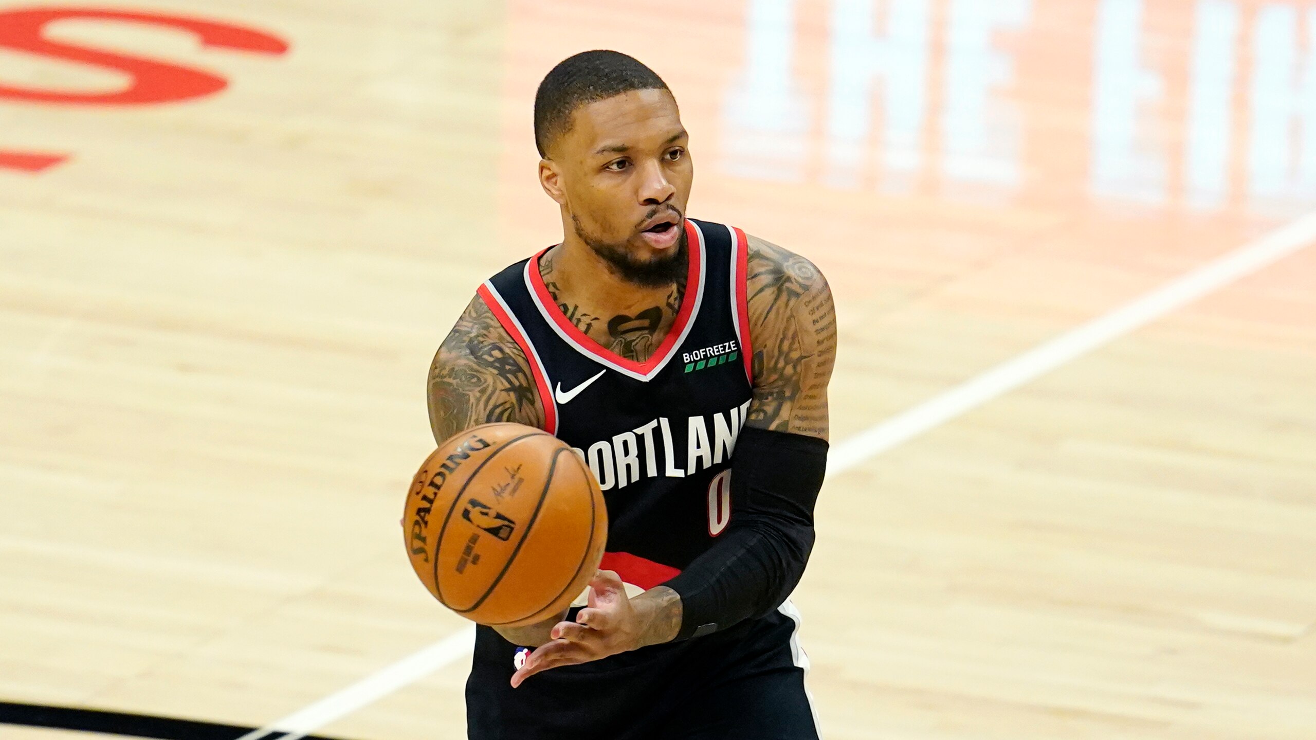 Portland Trail Blazers guard Damian Lillard passes during an NBA basketball game against the Los Angeles Clippers Tuesday, April 6, 2021, in Los Angeles. (AP Photo/Marcio Jose Sanchez)