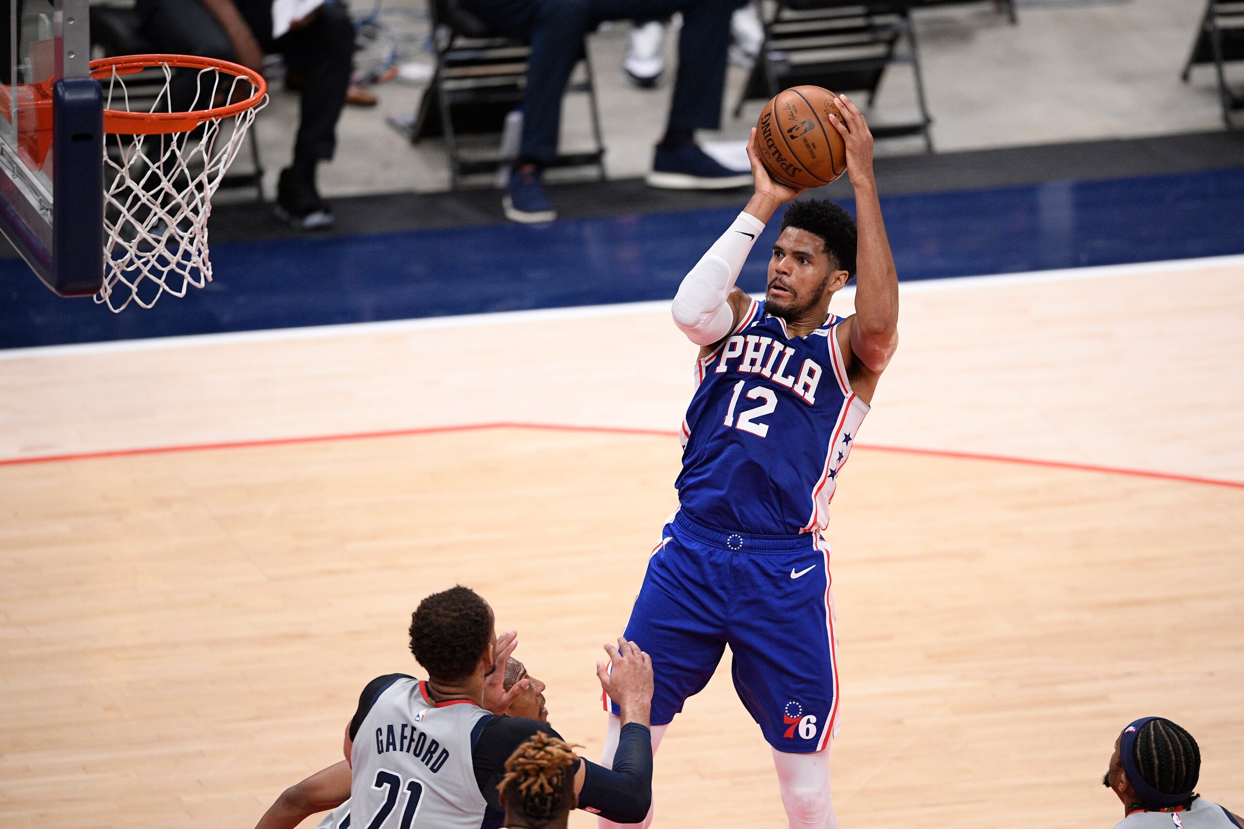 Philadelphia 76ers forward Tobias Harris (12) shoots against Washington Wizards center Daniel Gafford (21) during the second half of Game 4 in a first-round NBA basketball playoff series, Monday, May 31, 2021, in Washington. (AP Photo/Nick Wass)